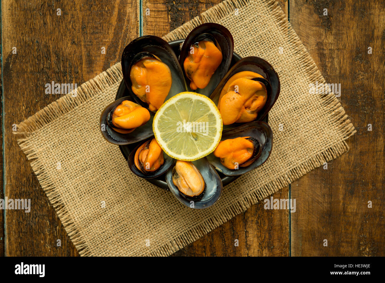 Delicius appetizer with natural mussels and lemon Stock Photo Alamy