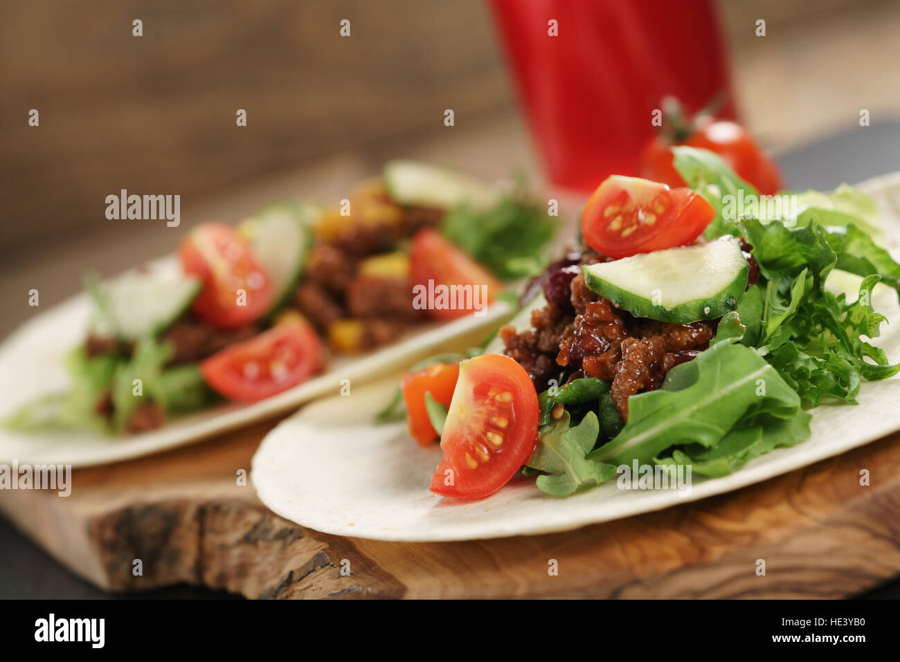 homemade open tortilla sandwich with beef, frisee, beans and corn Stock Photo