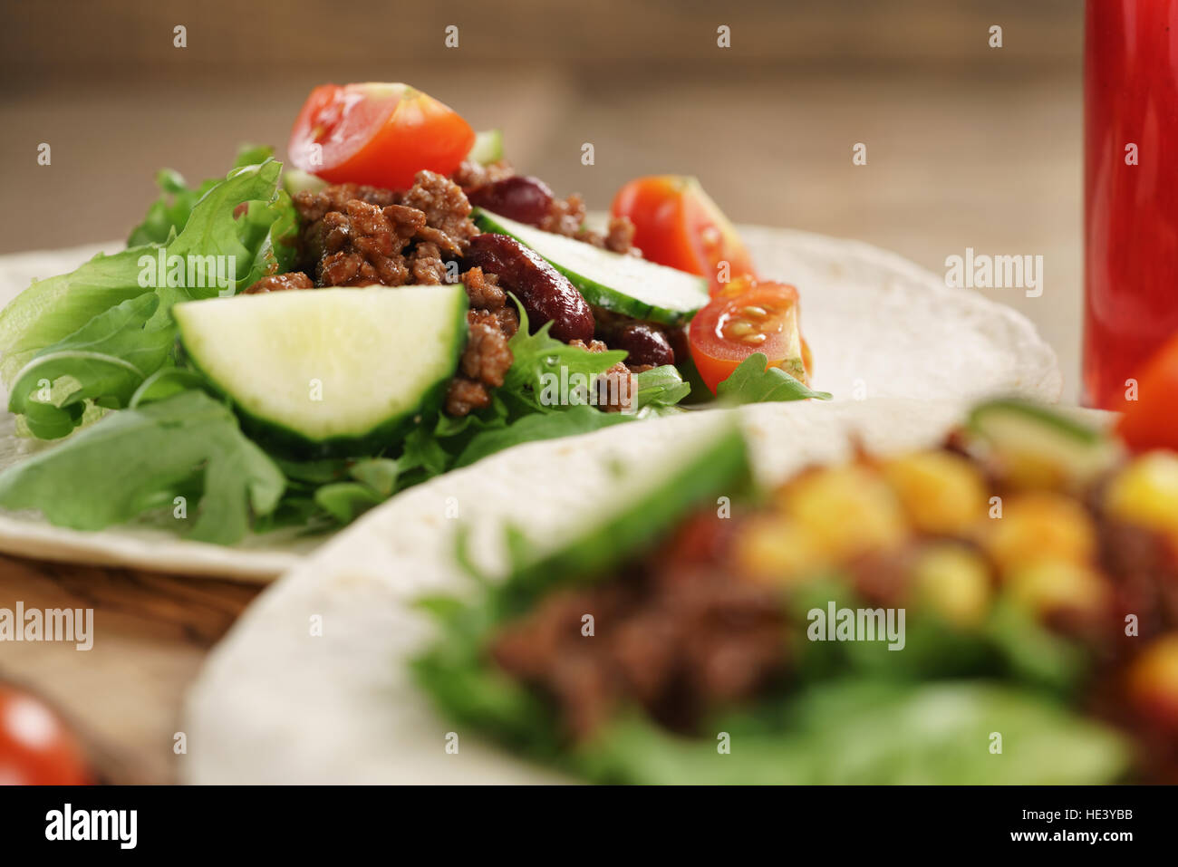 homemade open tortilla sandwich with beef, frisee, beans and corn Stock Photo
