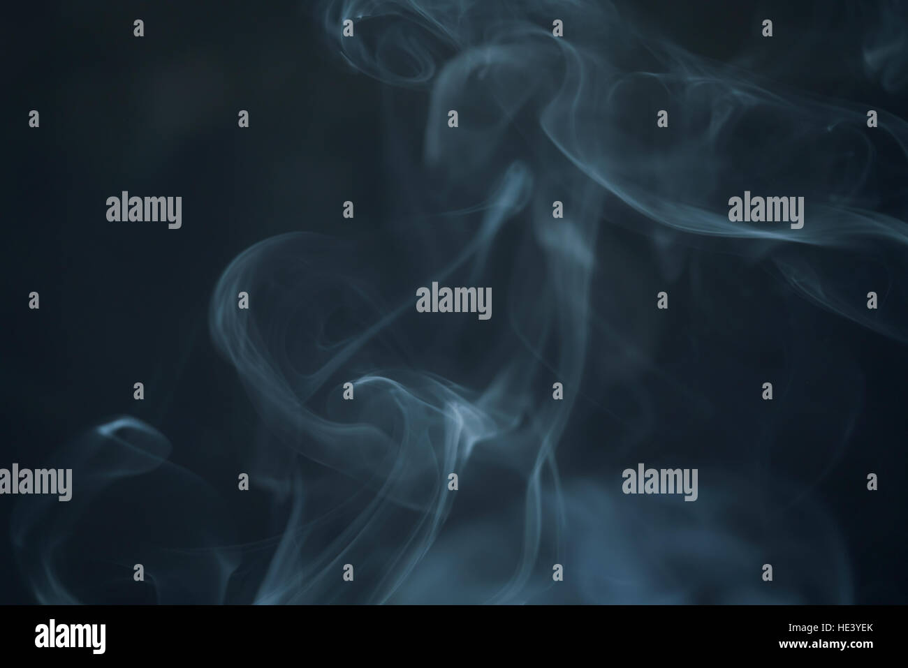 real blue smoke background in dark environment Stock Photo - Alamy