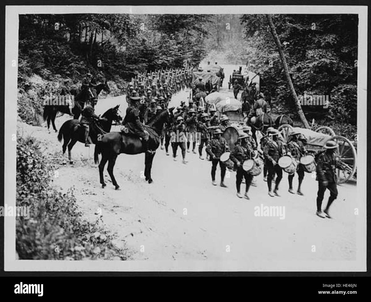 WW1 UK photo Manchester Regiment marching down winter road France WW1 UK photo Manchester Regiment marching down winter road France
