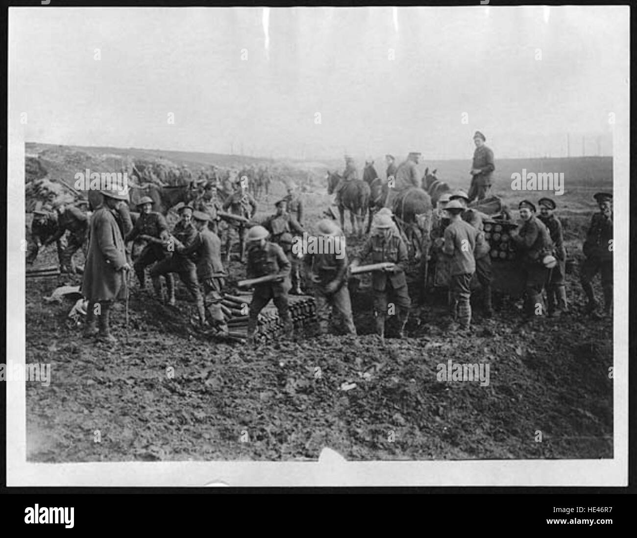 This historical image shows soldiers unloading ammunition, likely from ...