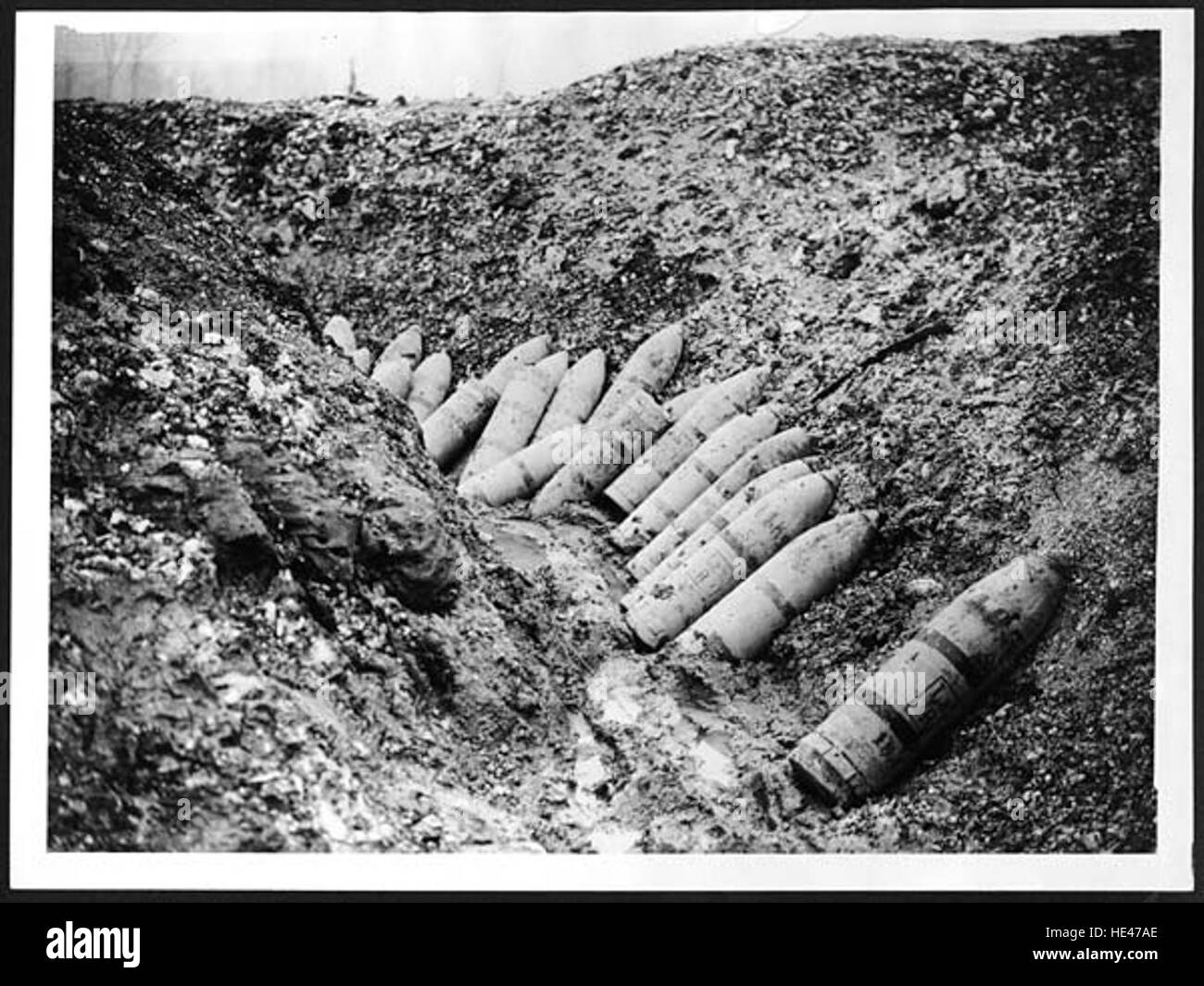 This photograph captures remnants of German ammunition left in a trench ...