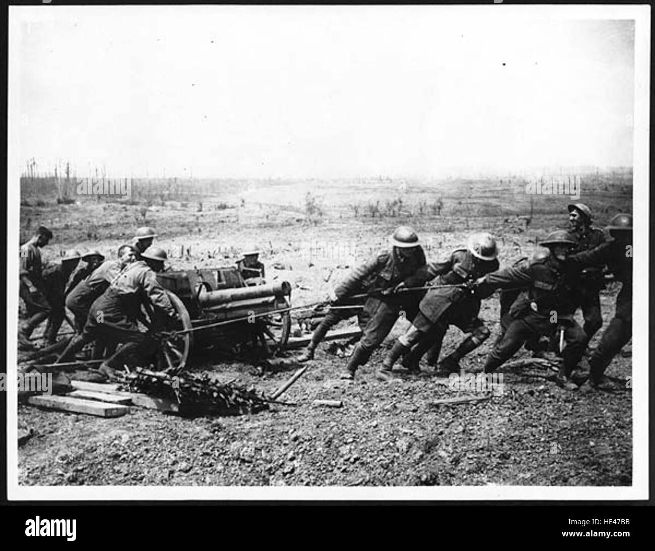 This historic photograph captures a German gun being hauled out after ...