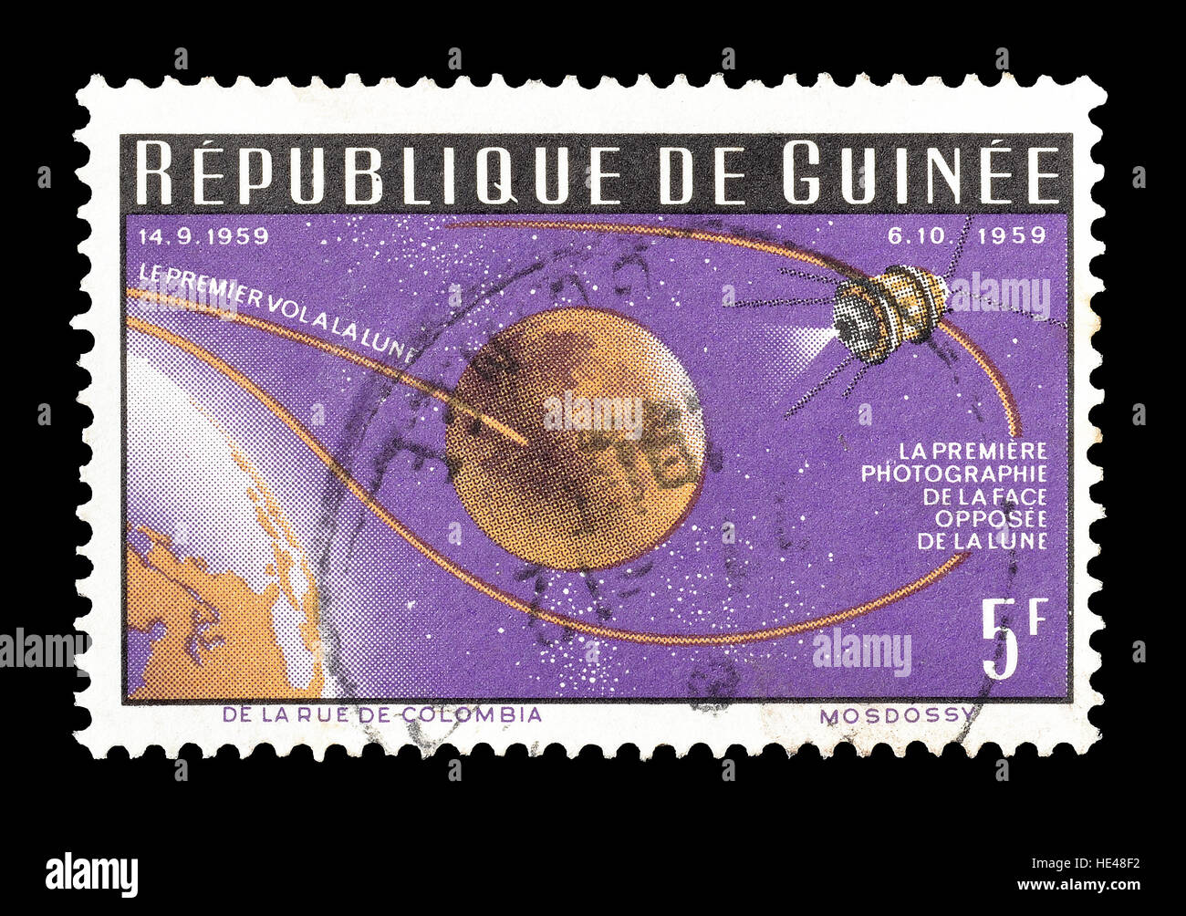Cancelled postage stamp printed by Guinea, that shows Photographing far side of the Moon. Stock Photo