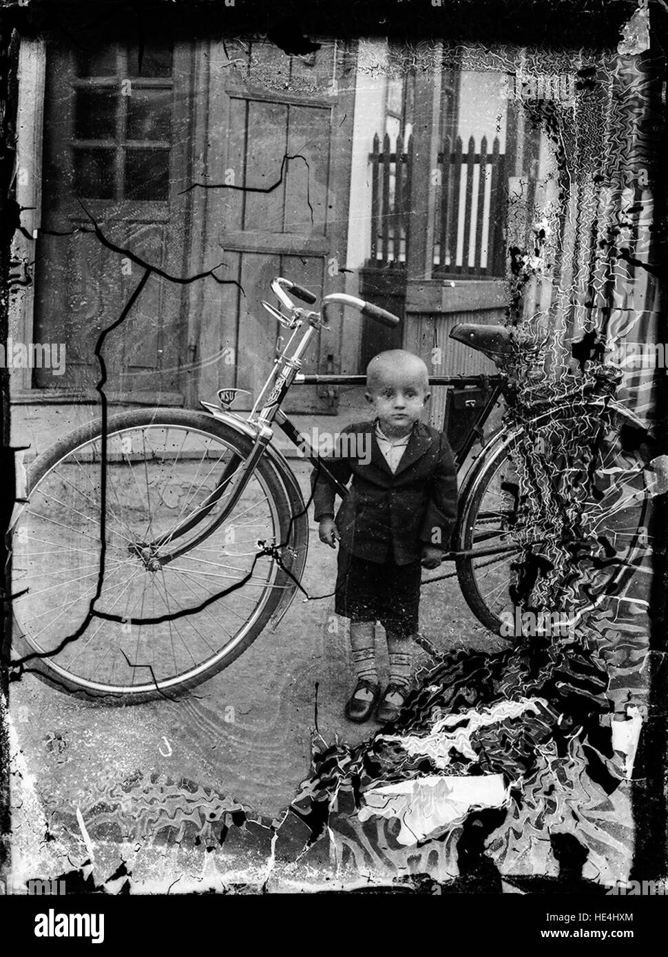A kid with a NSU bike ( https://en.wikipedia.org/wiki/NSU Motorenwerke ) . Stock Photo
