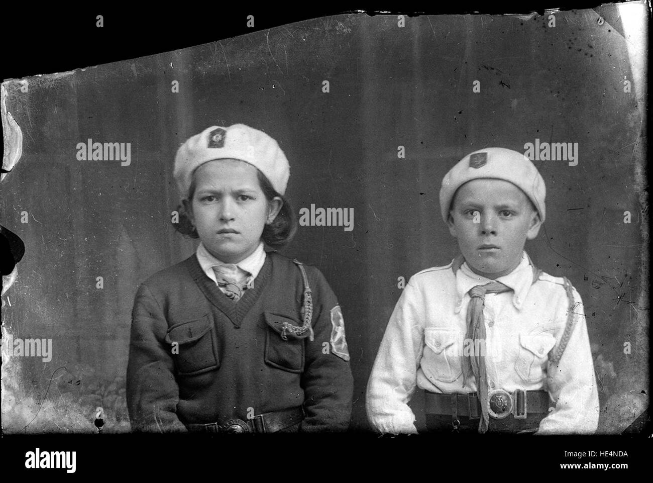 A boy and a girl wearing &quot;Straja Țării&quot; uniforms en.wikipedia.org/wiki/Straja %C8%9A%C4%83rii ( http://en.wikipedia.org/wiki/Straja %c8%9a%c4%83rii ) Stock Photo