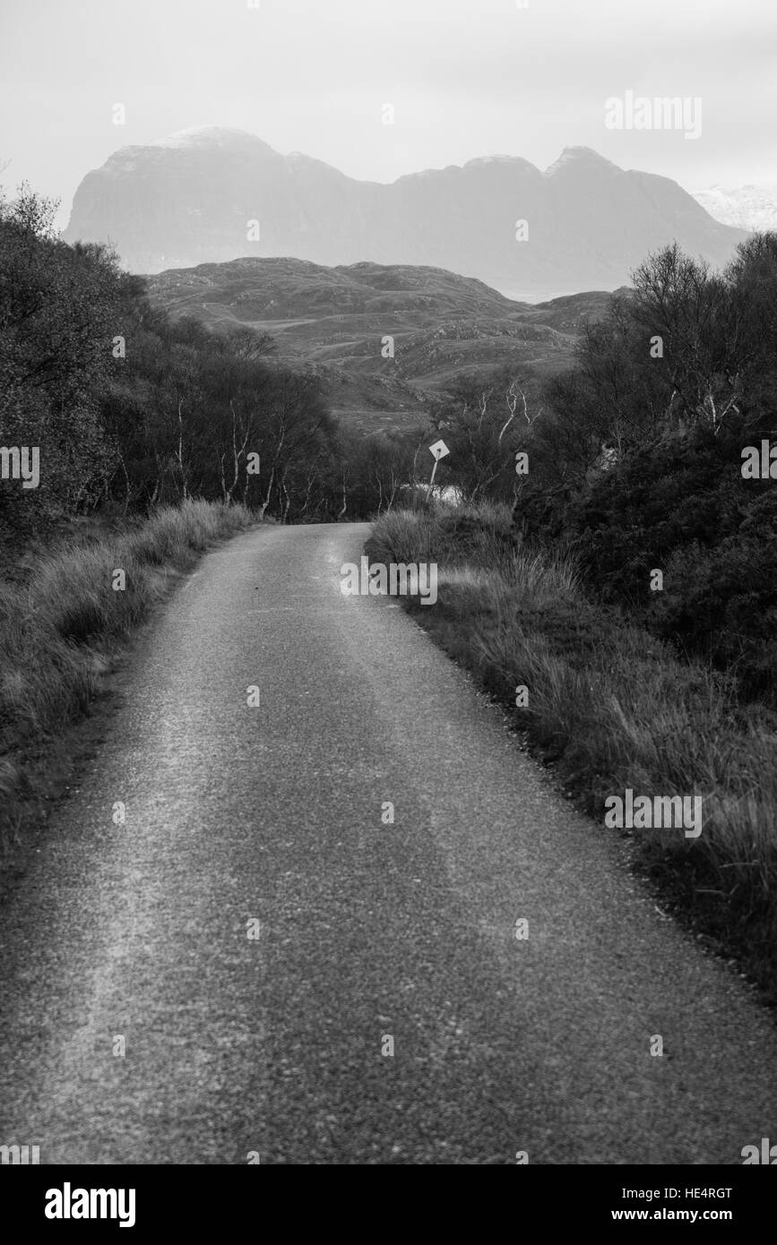 Scottish single track road with mountain. Stock Photo