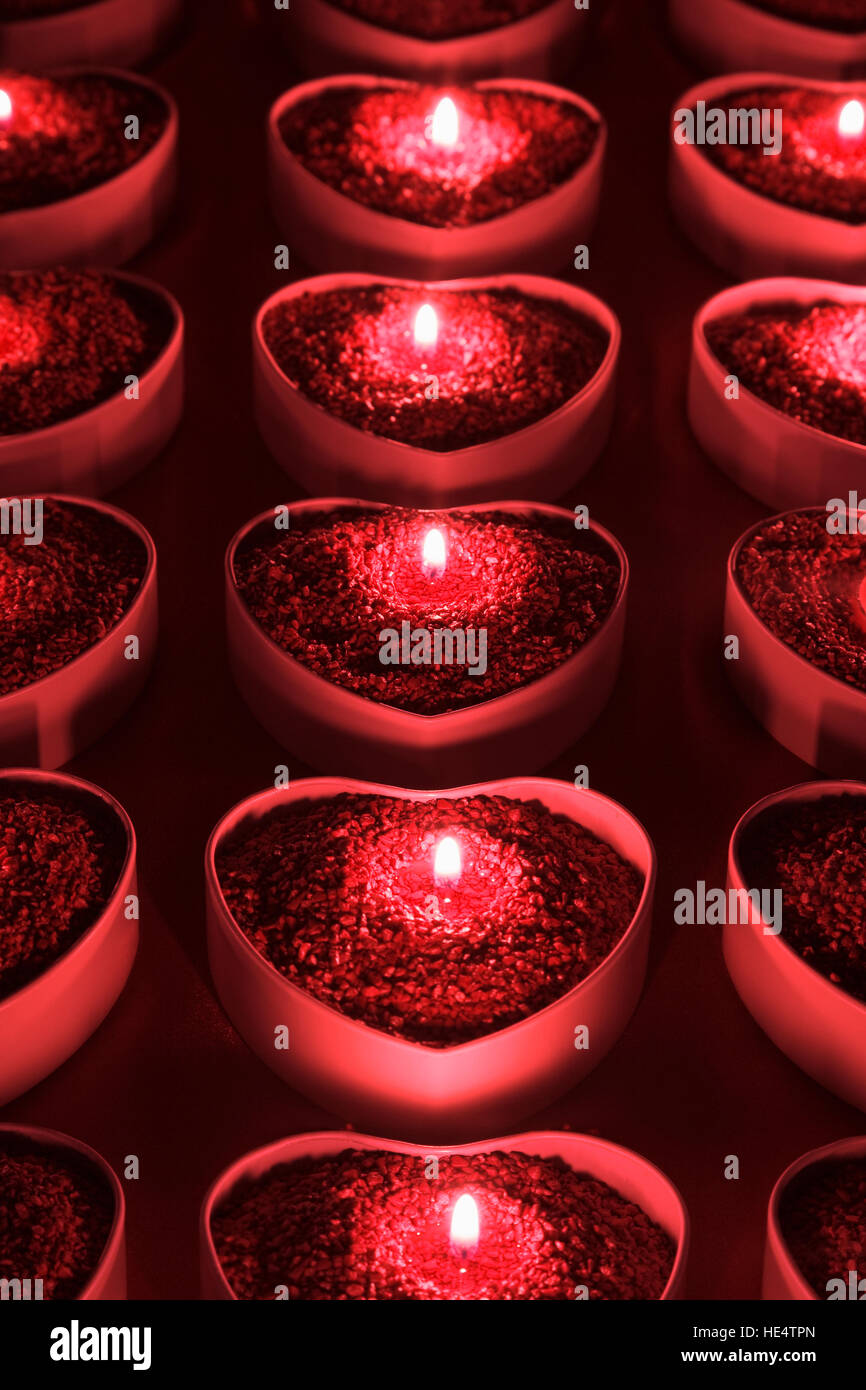 Heart shape candle holders with lighted candles inside Stock Photo Alamy