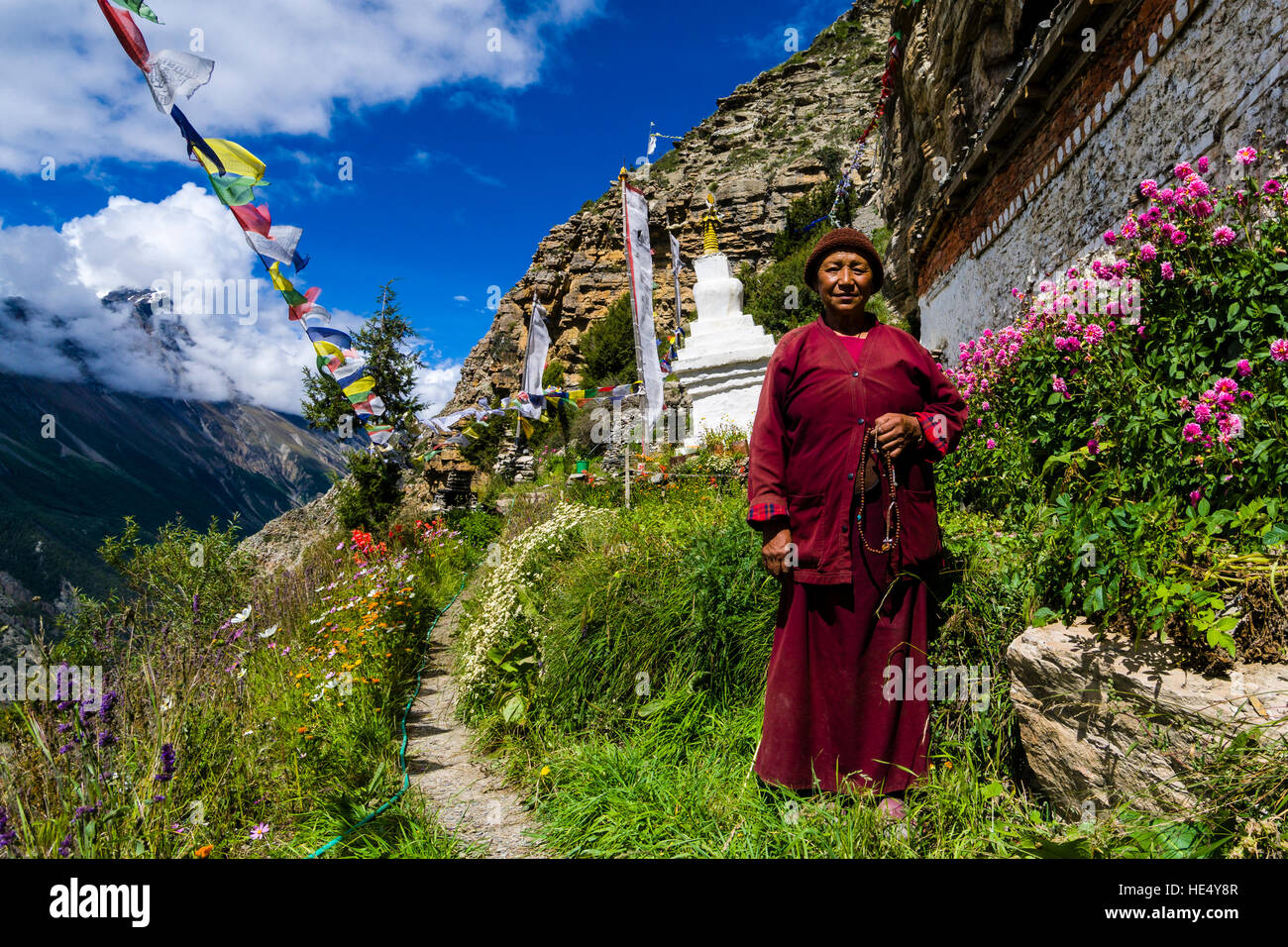 The Praken Gompa, the former home of Tashi Lama, located high above Manang, is now run by his doughter Ani Chorten Stock Photo