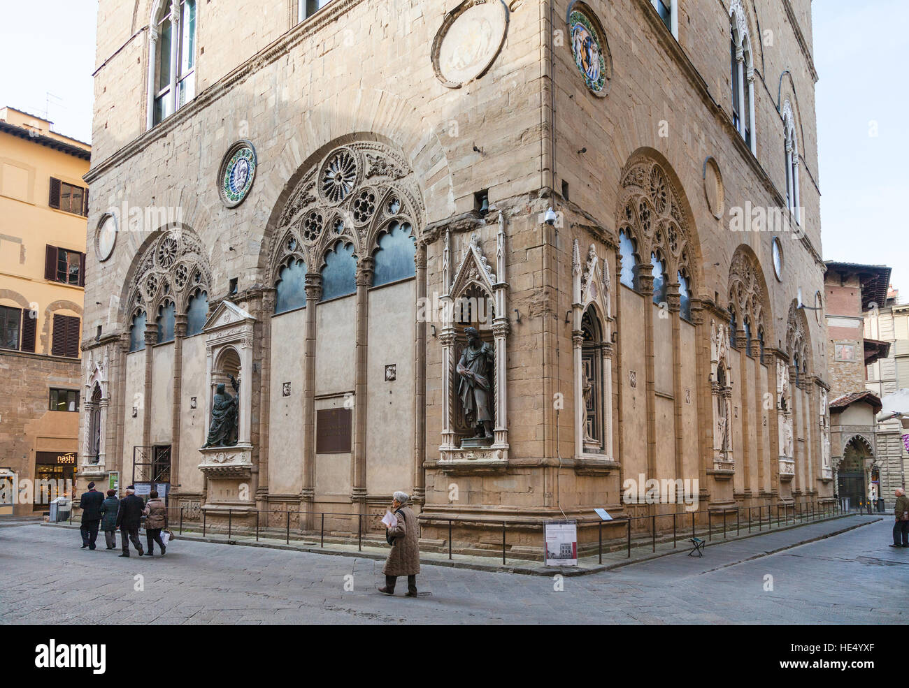 FLORENCE, ITALY - NOVEMBER 4, 2016: people near Orsanmichele church building on Florence city streets. Church was originally built as a grain market i Stock Photo