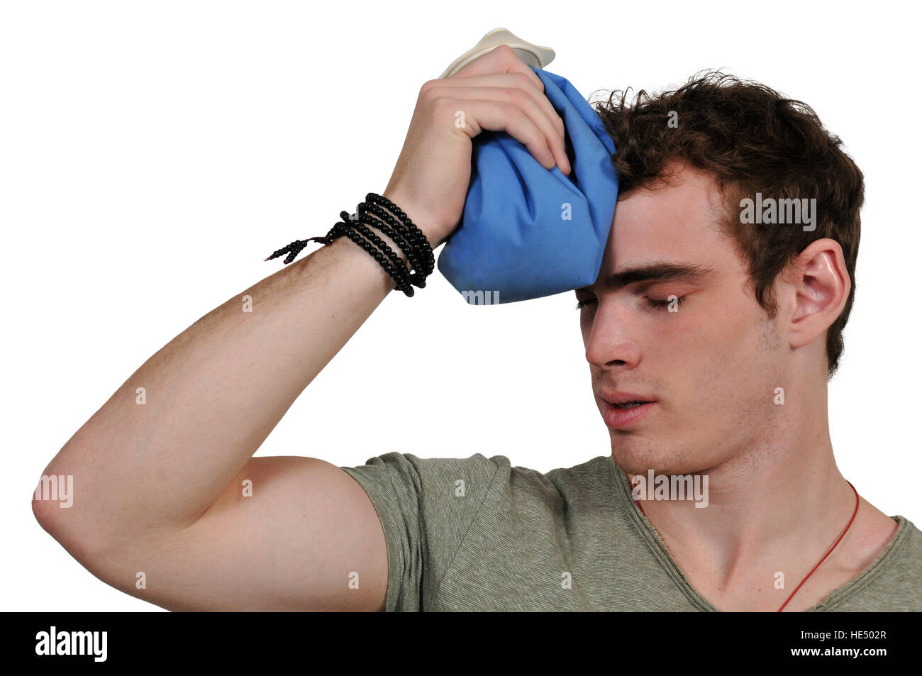 Handsome man using an ice pack for a headache Stock Photo Alamy