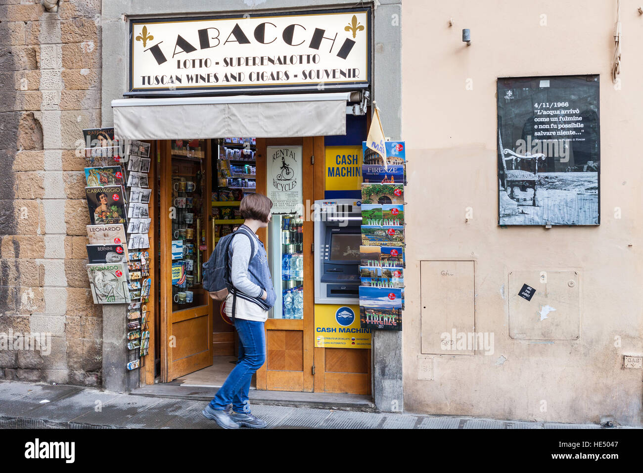 FLORENCE, ITALY NOVEMBER 6, 2016 tourist near Tabacchi kiosk