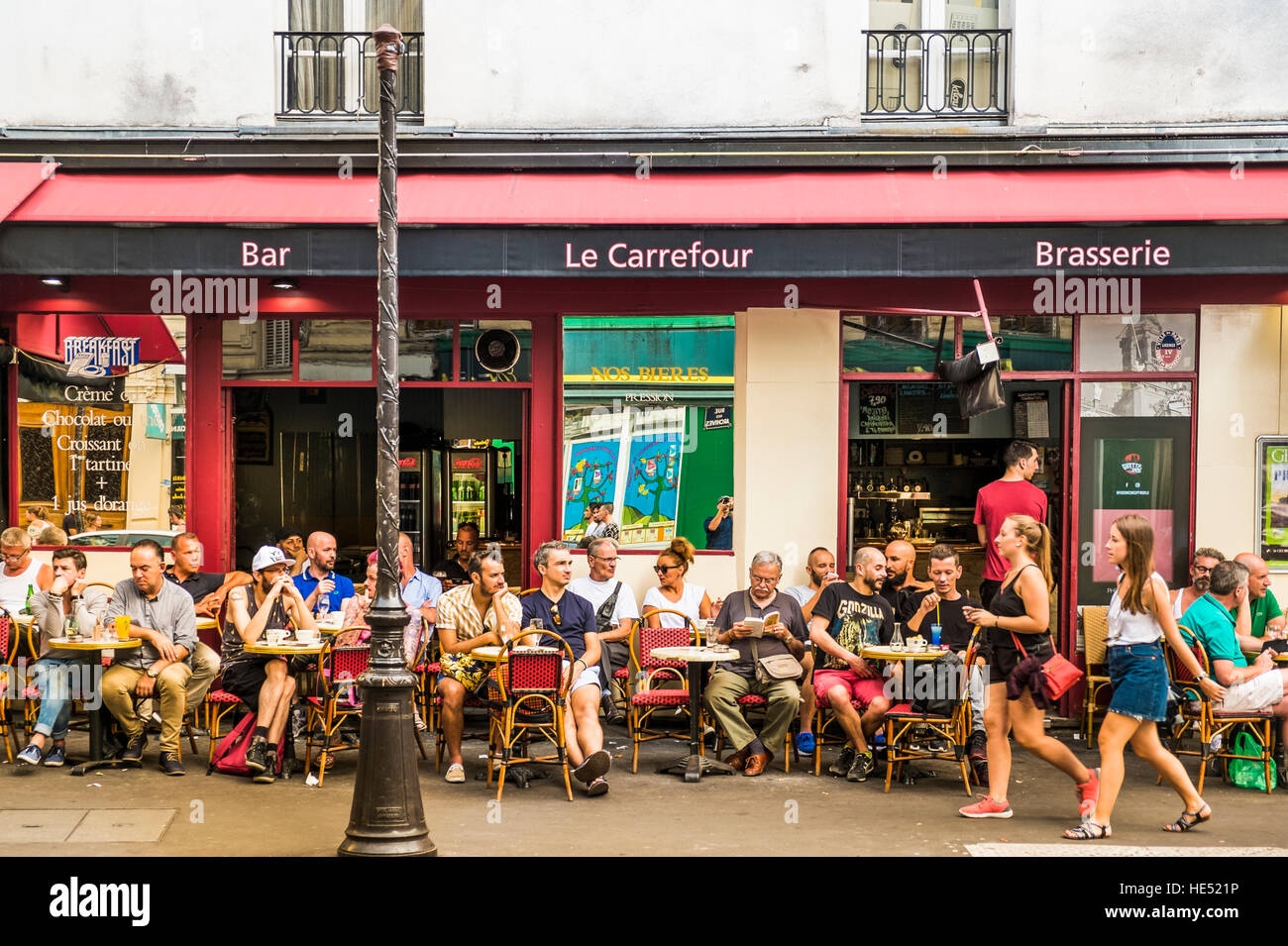 street scene in front of le carrefour, bar, brasserie Stock Photo