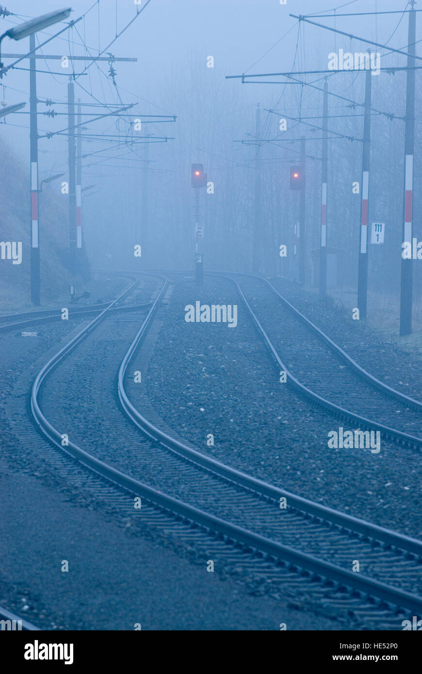 Train tracks in the fog Stock Photo