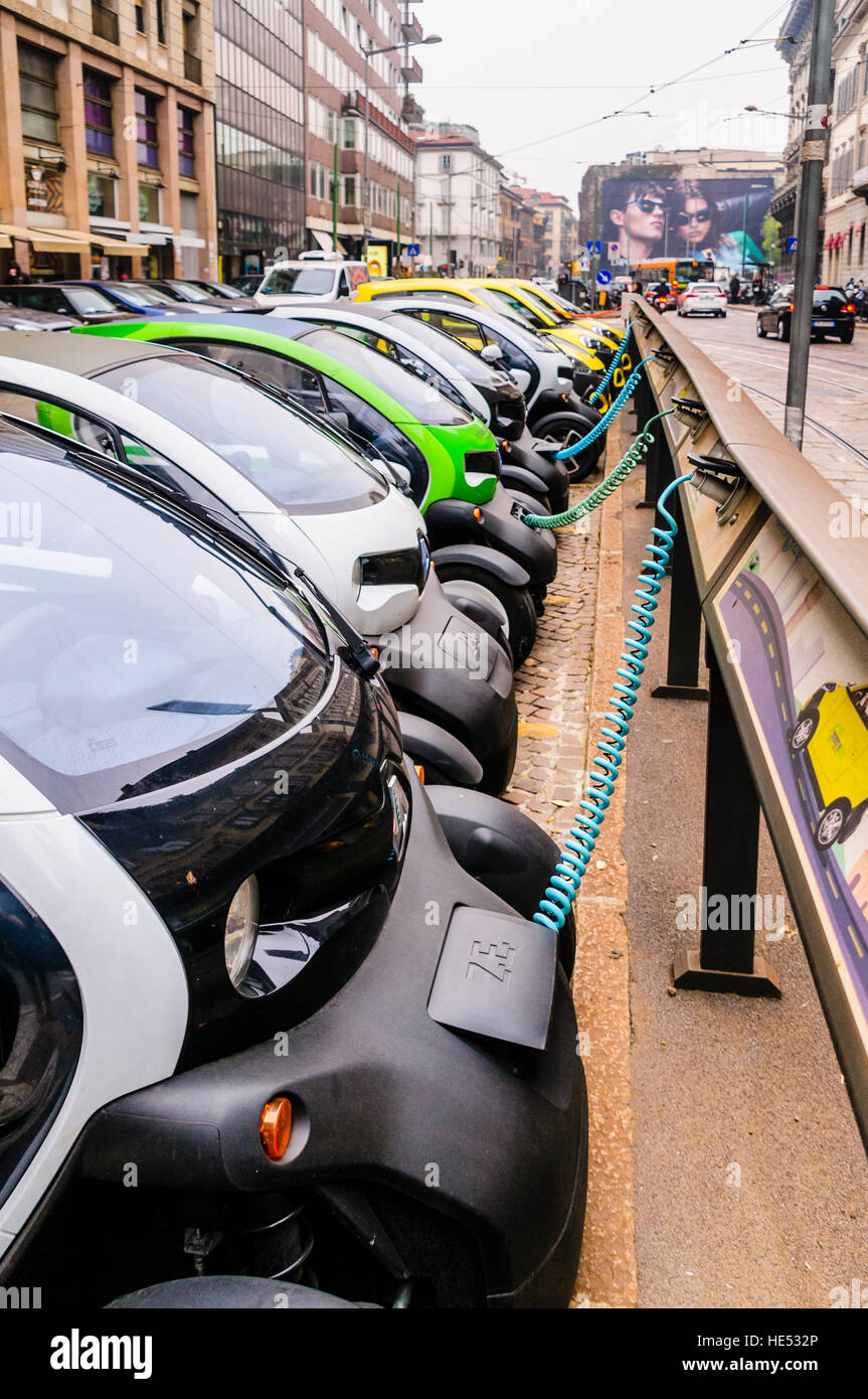 A number of Renault Twizy two seater city vehicles lined up at a charging station. Stock Photo