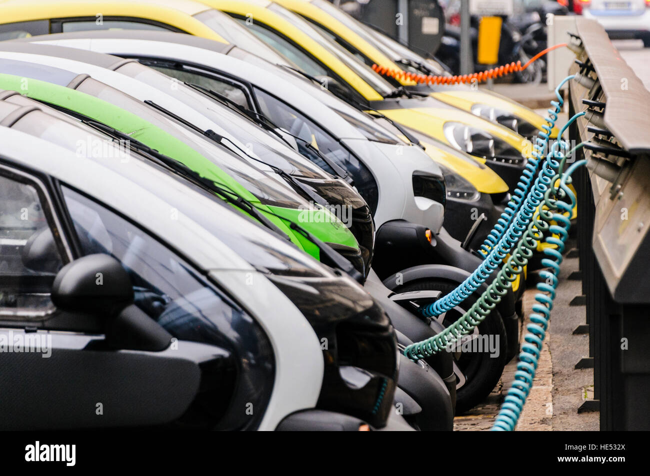 A number of Renault Twizy two seater city vehicles lined up at a charging station. Stock Photo