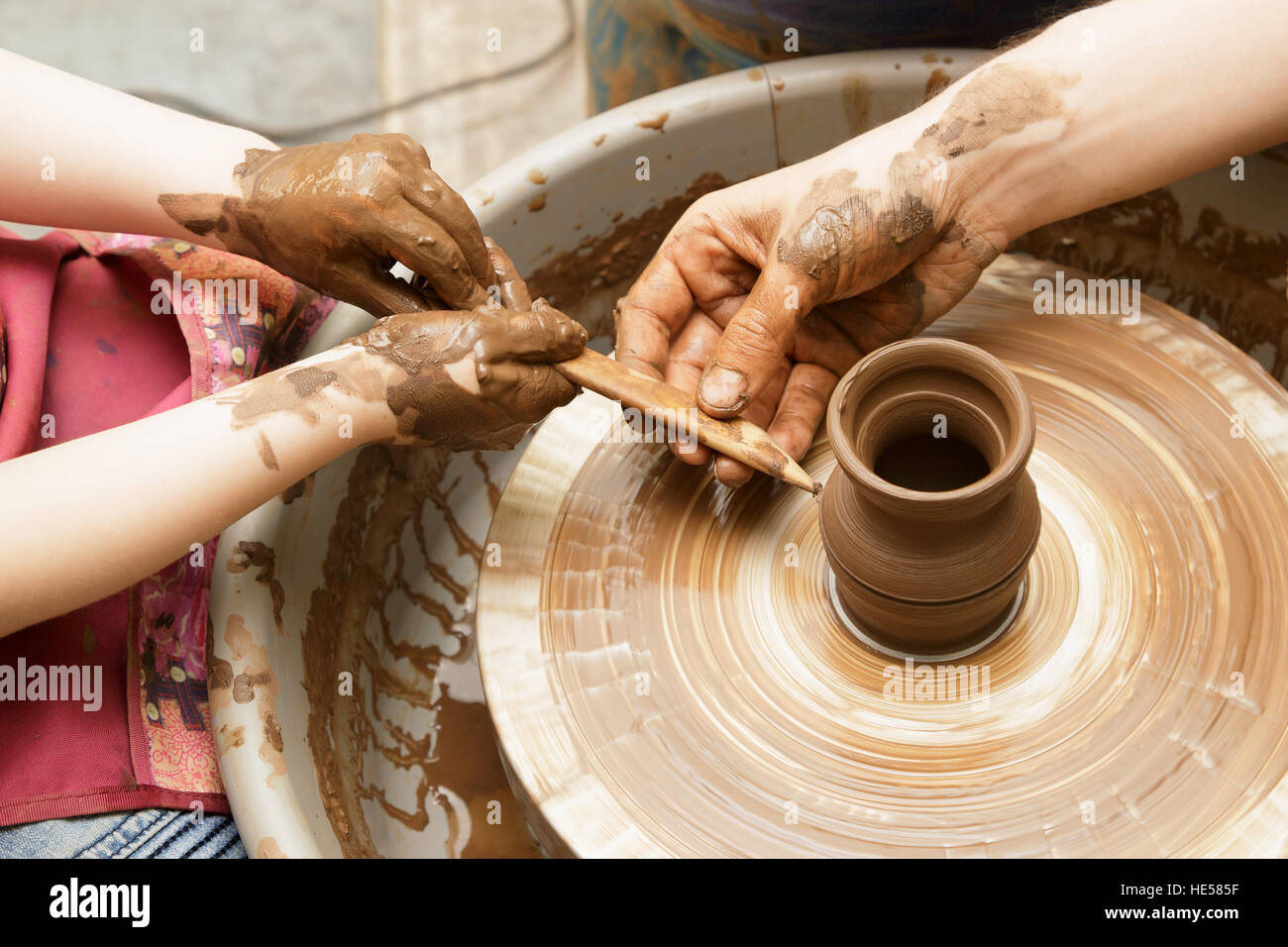 I dont mind getting my hands dirty. an unrecognizable woman molding clay on  a pottery wheel Stock Photo - Alamy