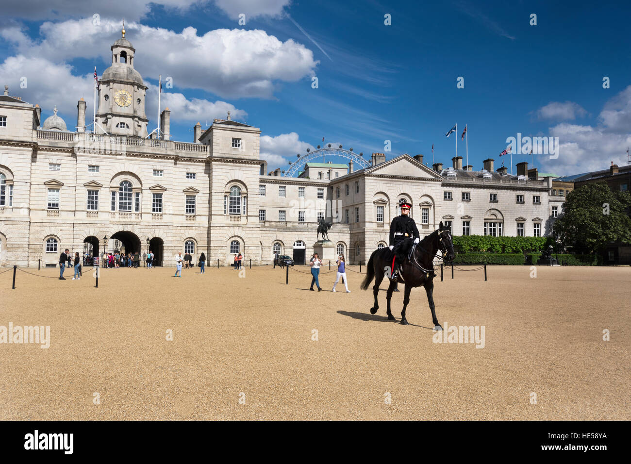 Guard rides Horse through London Horse Guard Parade Stock Photo