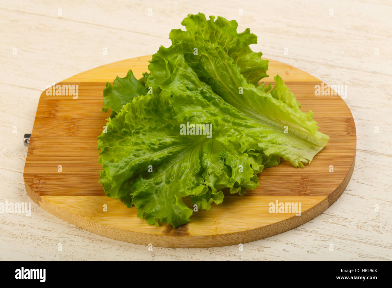 Fresh bright green Salad leaves over wood background Stock Photo Alamy
