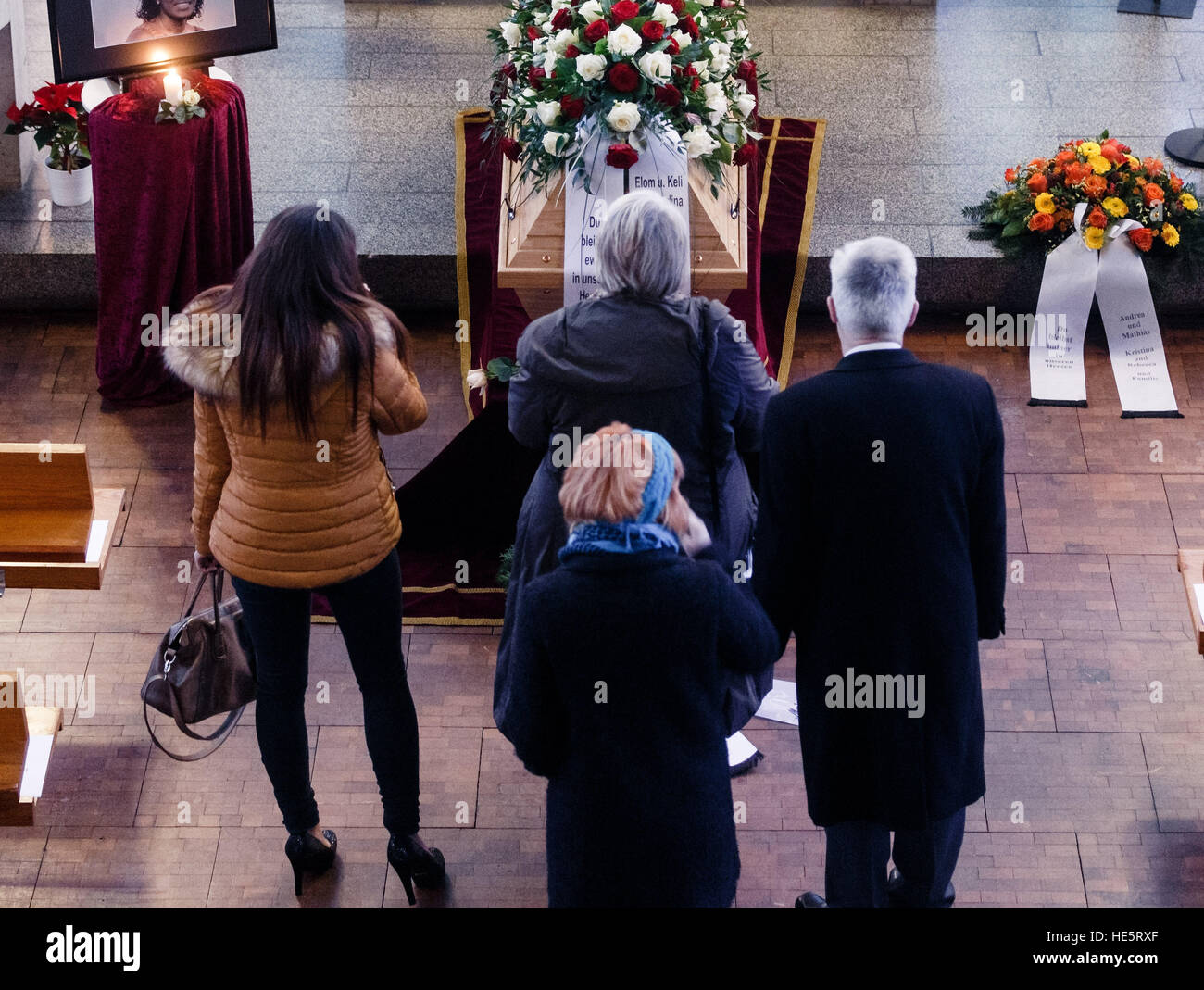 Kiel, Germany. 17th Dec, 2016. People attending the funeral stand by the coffin of the woman who