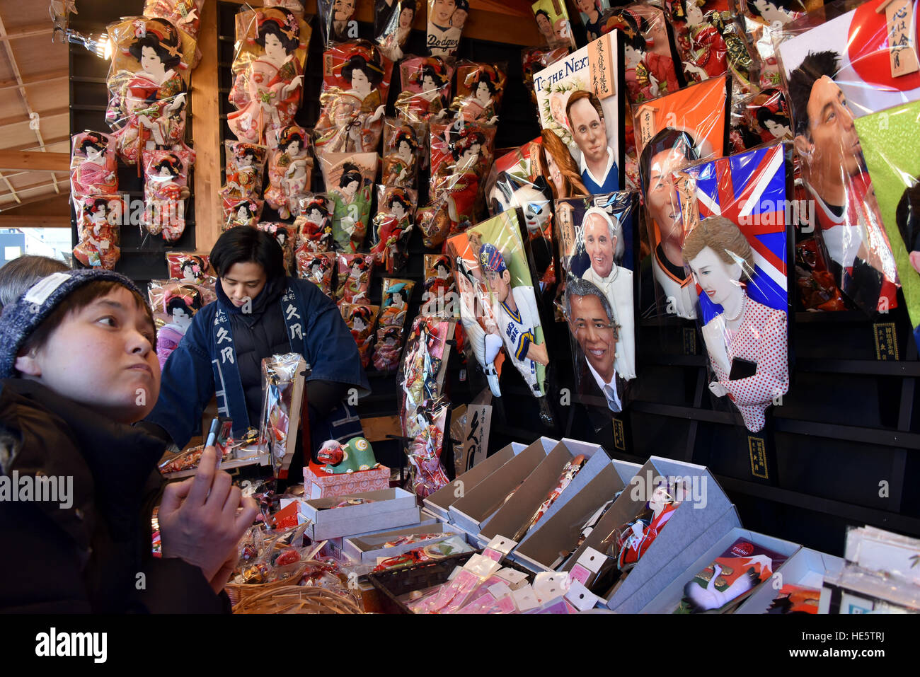 Tokyo, Japan. 17th Dec, 2016. Hundreds of colorful hagoitas or battledores, bearing raised cloth images of popular celebrities, are sold during an annual year-end fair at Tokyos Asakusa on Saturday, December 17, 2016. Some 330,000 visitors are expected to turn out for the three-day annual fair to buy or just to browse thousands of hagoitas sold by vendors along the mall of Asakusas iconic Sensoji Temple. © Natsuki Sakai/AFLO/Alamy Live News Stock Photo