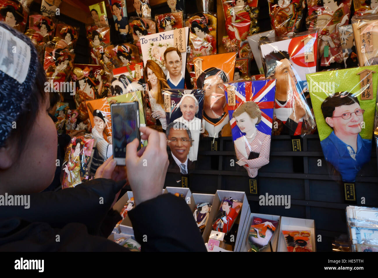 Tokyo, Japan. 17th Dec, 2016. Hundreds of colorful hagoitas or battledores, bearing raised cloth images of popular celebrities, are sold during an annual year-end fair at Tokyos Asakusa on Saturday, December 17, 2016. Some 330,000 visitors are expected to turn out for the three-day annual fair to buy or just to browse thousands of hagoitas sold by vendors along the mall of Asakusas iconic Sensoji Temple. © Natsuki Sakai/AFLO/Alamy Live News Stock Photo