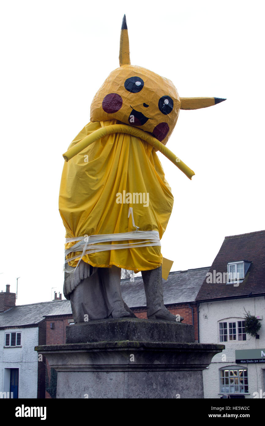 17th December 2016. Dunchurch, Warwickshire, England, UK. The statue of Lord Douglas Scott in Dunchurch village in Warwickshire has taken a different guise over the Christmas period for many years. This year the statue which is clearly visible at the crossroads in the village centre has taken the form of a Pokemon. Stock Photo