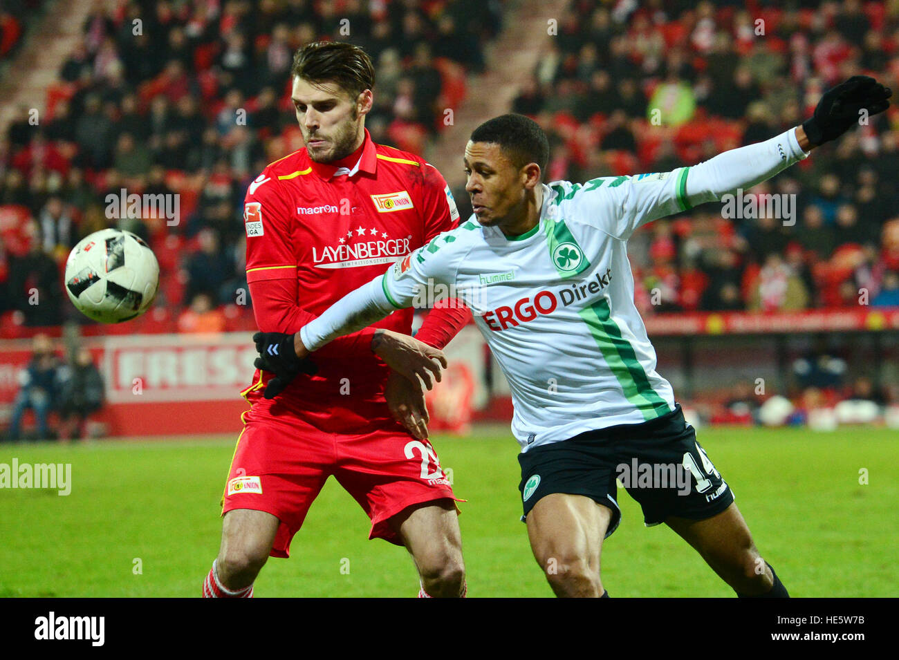 Berlin, Germany. 16th Dec, 2016. Christopher Trimmel of FC Union Berlin and Mathis Bolly of SpVgg Greuther Fuerth vie for the ball during the 2nd Bundesliga soccer match between 1. FC Union Berlin and SpVgg Greuther Fuerth at the An der Alten Foersterei stadium in Berlin, Germany, 16 December 2016. Photo: Maurizio Gambarini/dpa/Alamy Live News Stock Photo