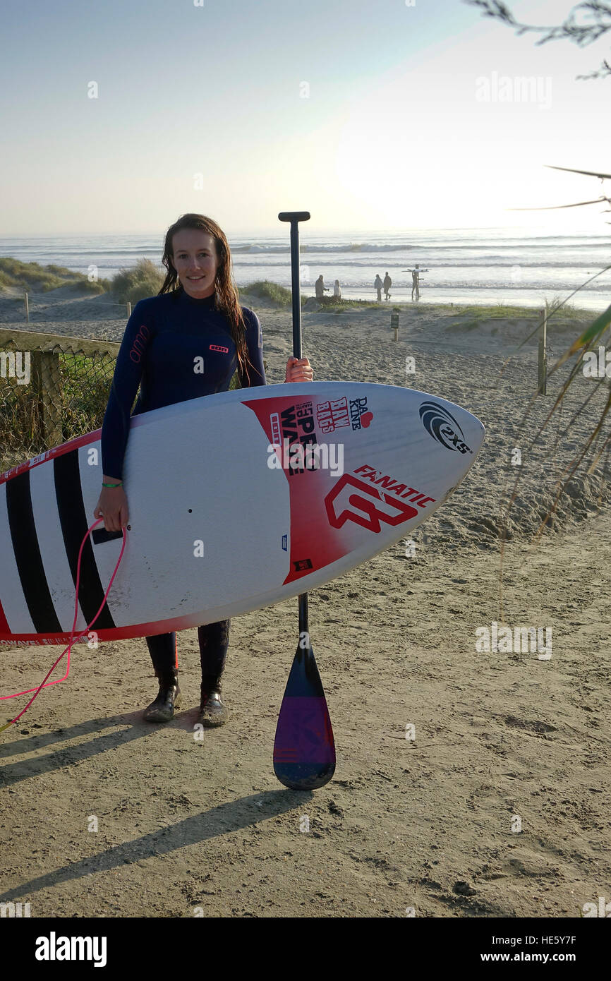 West Wittering, UK. 17th Dec, 2016. UK Weather: Foggy conditions gave way to warm and sunny conditions at West Wittering Beach in West Sussex. UK women's paddle boarding champion, Holly Bassett, enjoying the conditions. Credit: james jagger/Alamy Live News Stock Photo