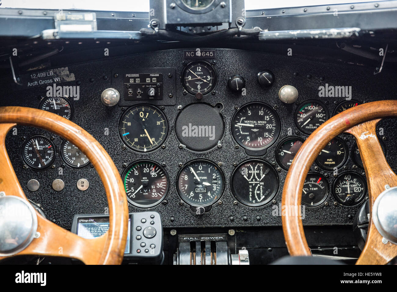 Groveland, California, USA. 16th Dec, 2016. Friday, December 16, 2016.The cockpit of a 1928 Ford Tri-Motor airplane. Volunteers from the Experimental Aircraft Association (EAA) are coordinating Tri-Motor flights from the Pine Mountain Lake (PML) airport, Groveland, California. This Ford Tri-Motor NC9645, nicknamed The Tin Goose, has a wingspan of 77 feet 6 inches and was constructed in 1928. It was named the City of Wichita, and it was used to introduce the first coast-to-coast passenger air/rail service in the United States on July 7, 1929, and the development and inauguration of the f Stock Photo
