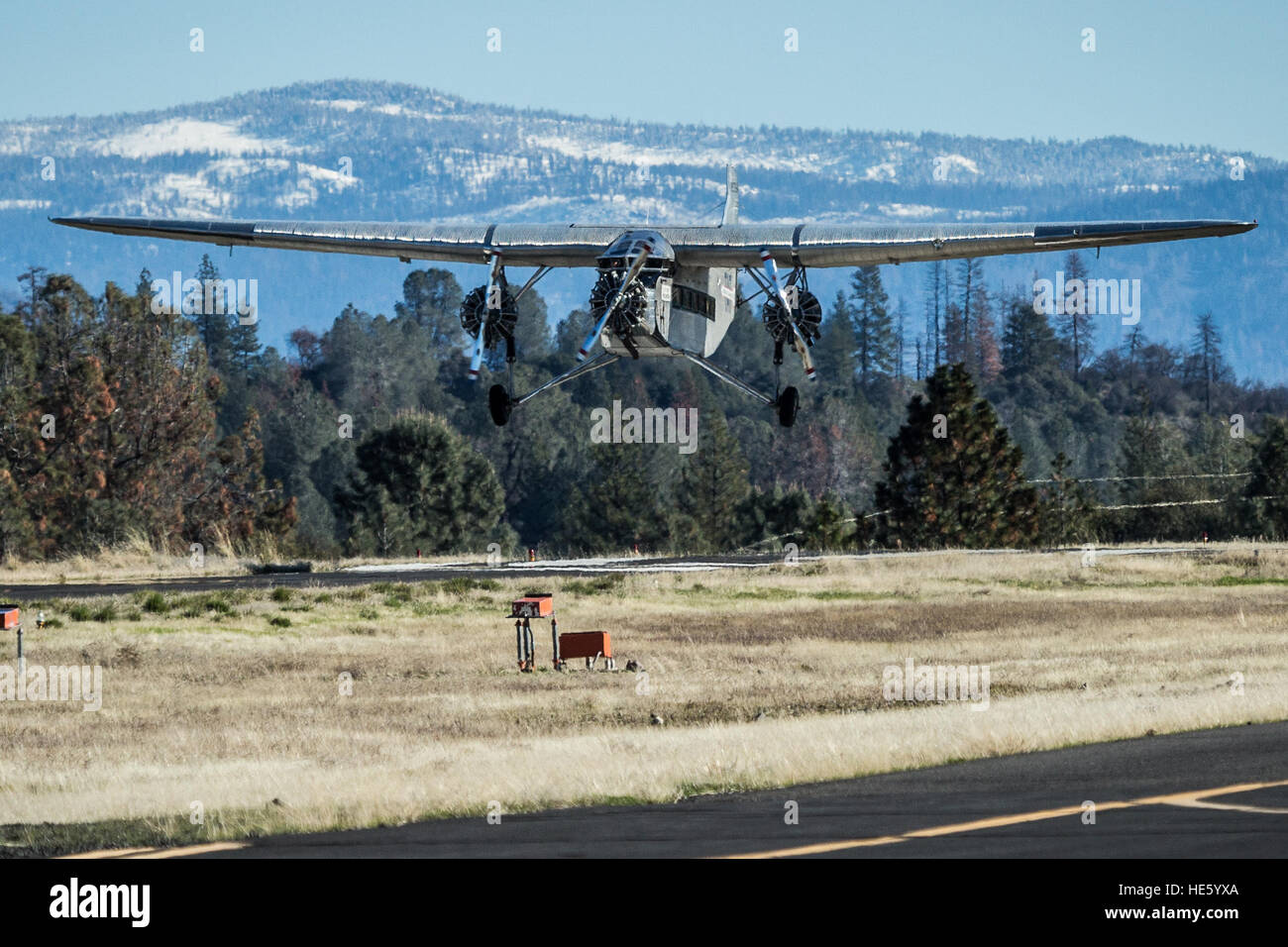 Groveland, California, USA. 17th Dec, 2016. Saturday, December 17, 2016.A 1928 Ford Tri-Motor airplane lands at the Pine Mountain Lake Airport in Groveland, California. This Ford Tri-Motor NC9645, nicknamed The Tin Goose, has a wingspan of 77 feet 6 inches and was constructed in 1928. It was named the City of Wichita, and it was used to introduce the first coast-to-coast passenger air/rail service in the United States on July 7, 1929, and the development and inauguration of the first all air passenger service on October 25, 1930. The plane can carry up to 10 passengers.Experimental Ai Stock Photo