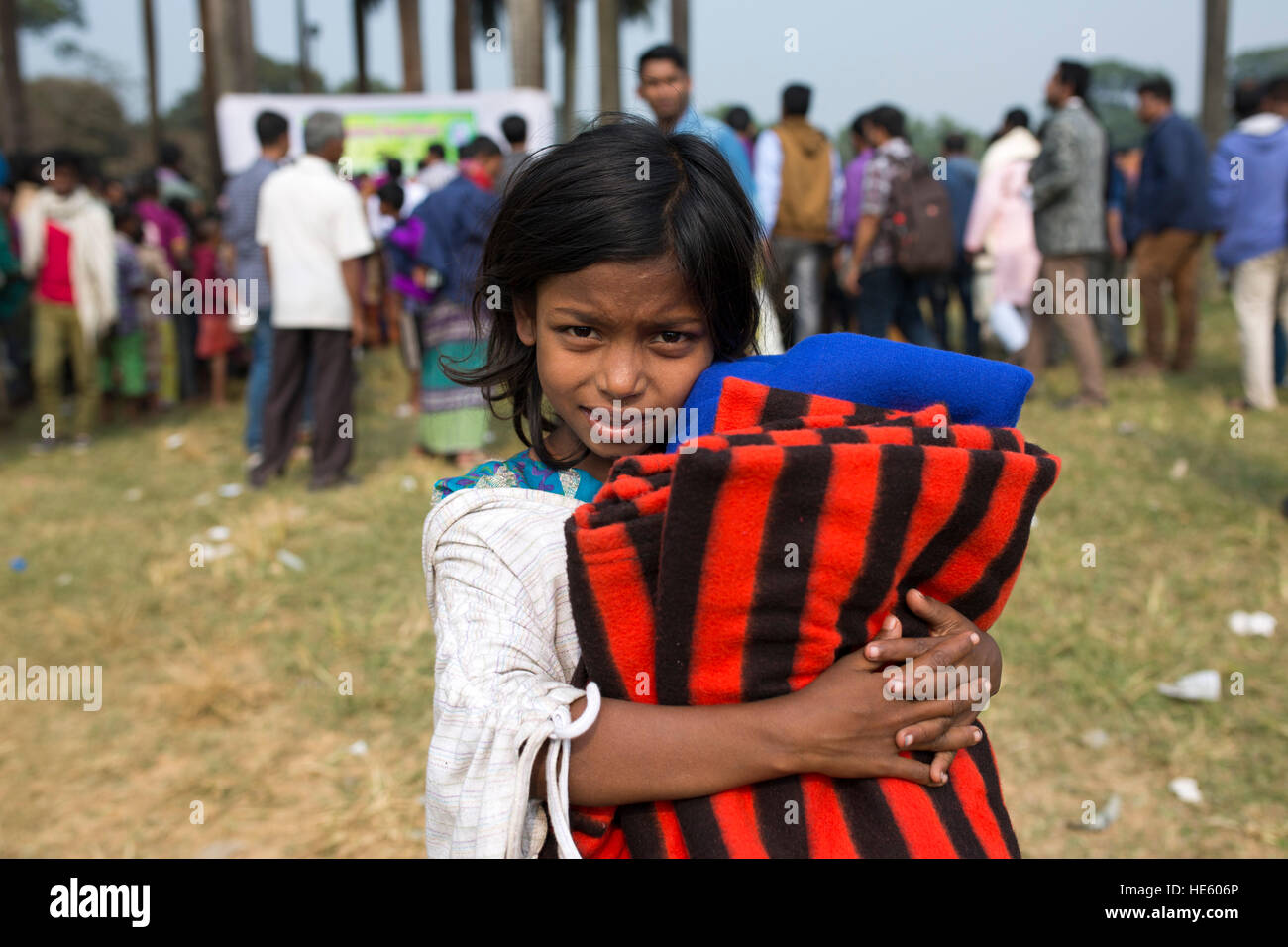 DHAKA, BANGLADESH DECEMBER 17 A street child shows her smile face
