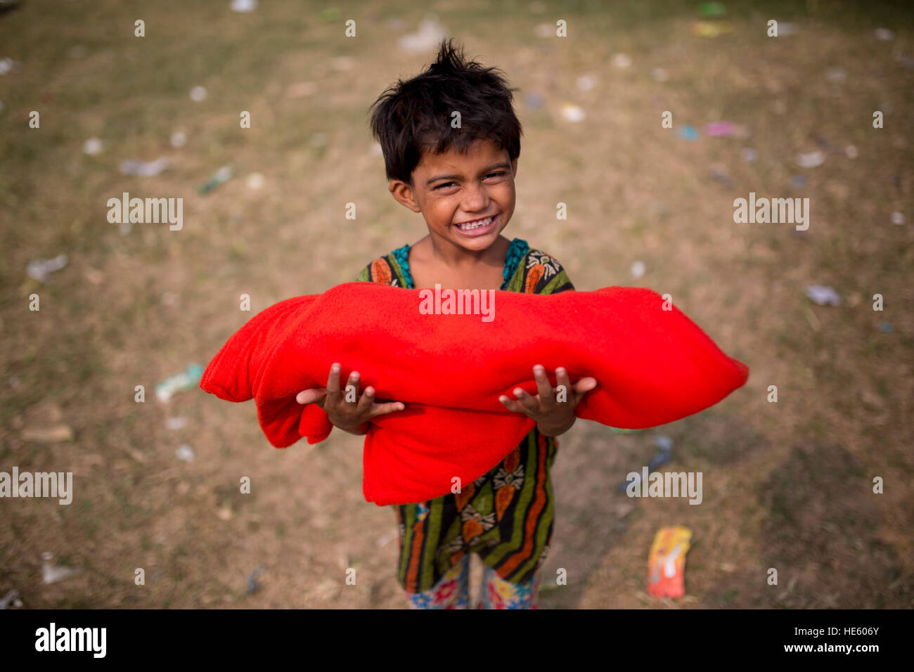 DHAKA, BANGLADESH DECEMBER 17 A street child shows her smile face