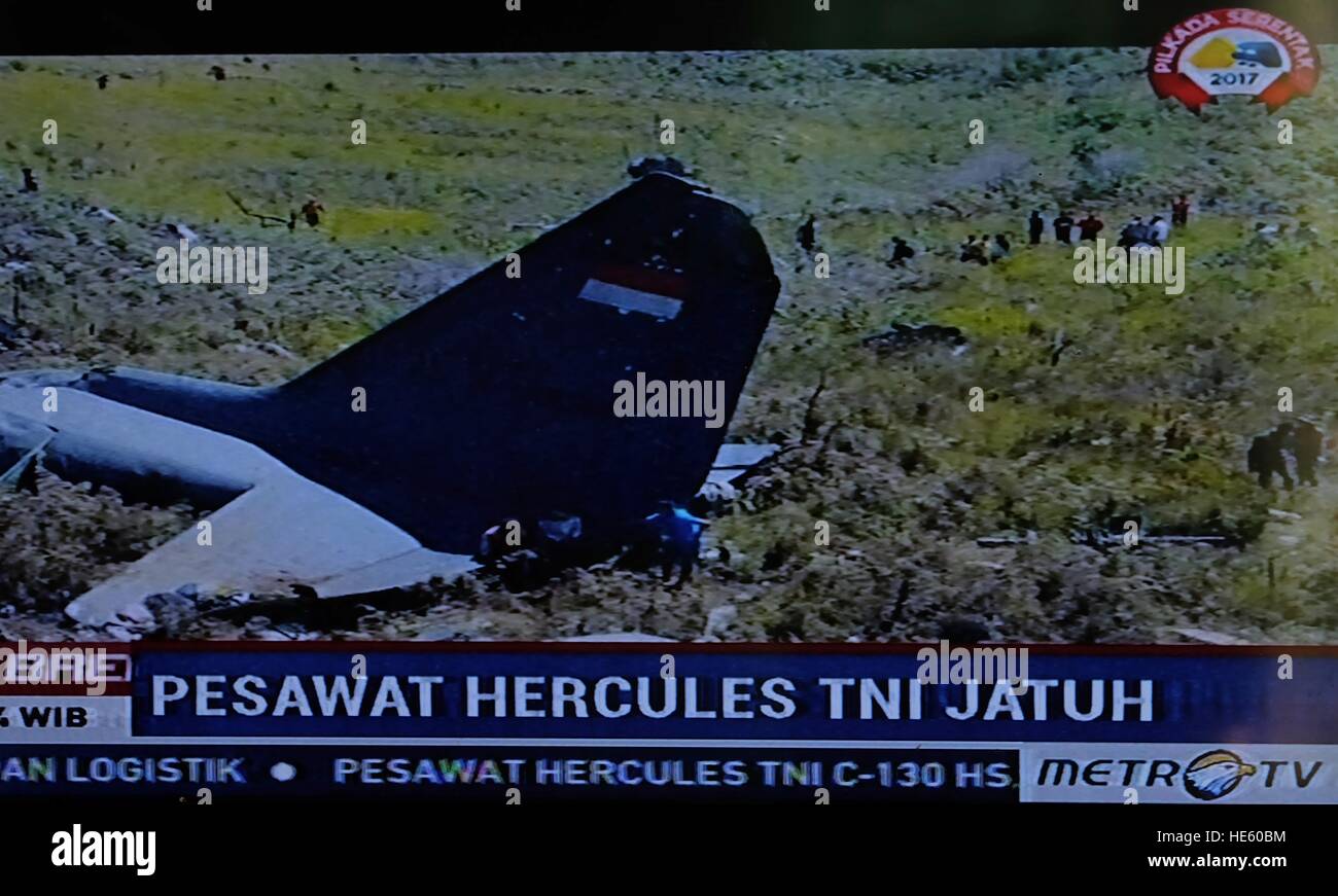 Papua. 18th Dec, 2016. A TV grab taken on Dec. 18, 2016 from Metro TV shows the image of debris of an Indonesian military plane crashed in the province of Papua, Indonesia. All 13 people on board died. Air force chief of staff Agus Supriatna told Metro TV the plane was carrying food supplies from Timika to Wamena when it crashed Sunday. © Metro TV/Xinhua/Alamy Live News Stock Photo