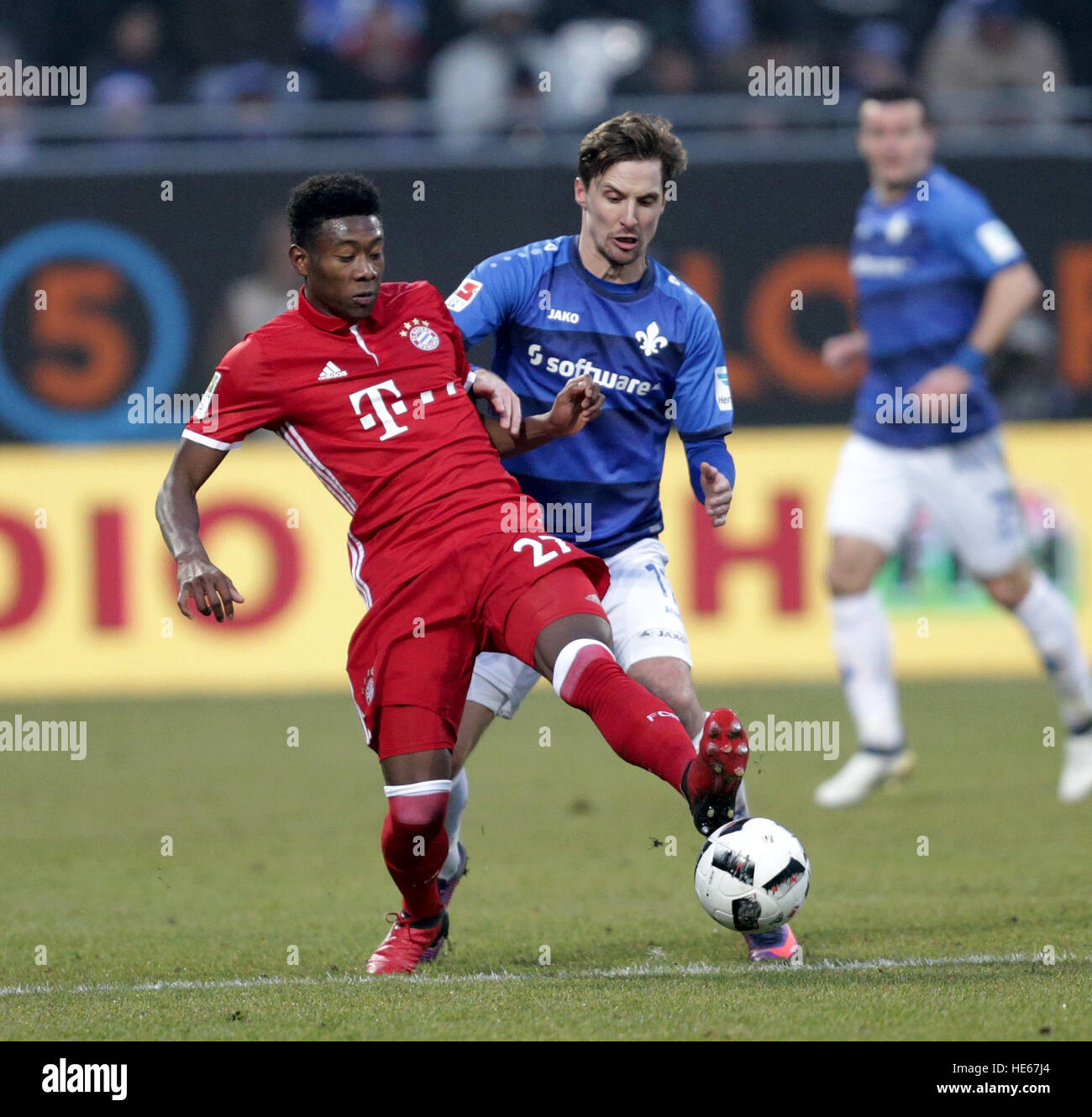 Darmstadst, Germany. 18th Dec, 2016. Darmstadt's Sandro Sirigu and Munich's David Alaba compete for the ball during the Bundesliga soccer match between Darmstadt 98 and Bayern Munich at Jonathan Heimes stadium in Darmstadst, Germany, 18 December 2016. Photo: Hasan Bratic/dpa/Alamy Live News Stock Photo