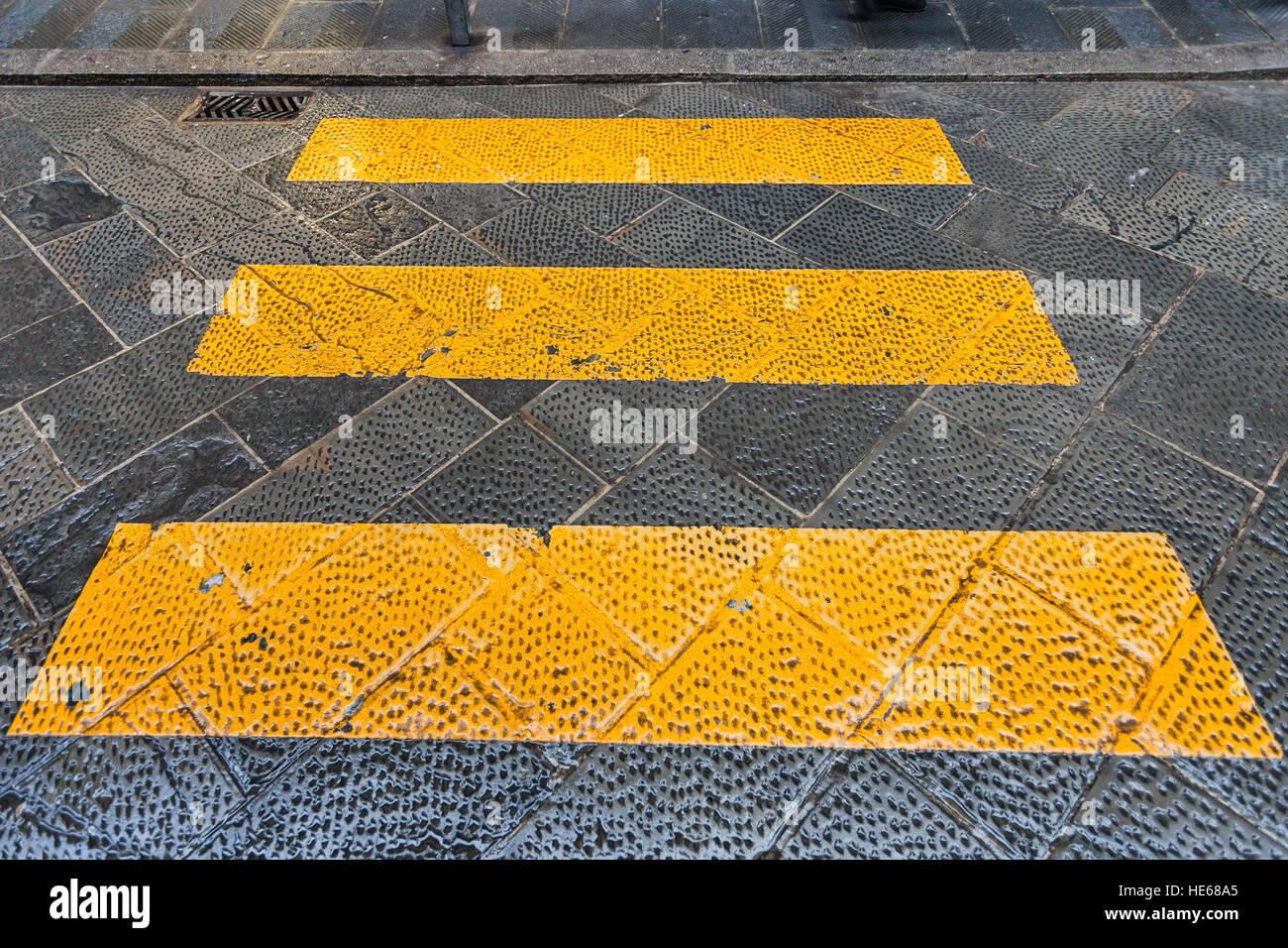 travel to Italy - yellow stripes crosswalk across the street in Florence city Stock Photo