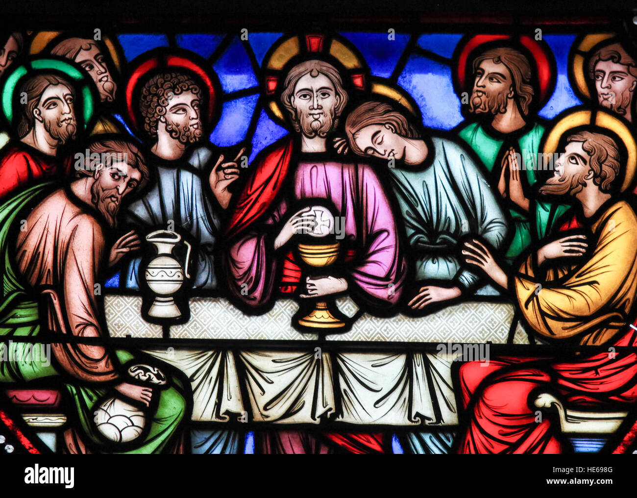 Stained glass window depicting Jesus and the twelve apostles on maundy thursday at the Last Supper in the cathedral of Brussels, Belgium. Stock Photo
