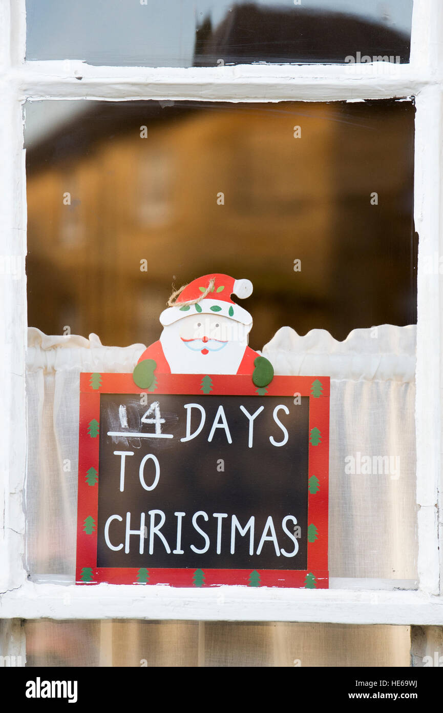 Christmas reminder sign in a cottage window. Chipping Campden, Cotswolds, Gloucestershire, England Stock Photo