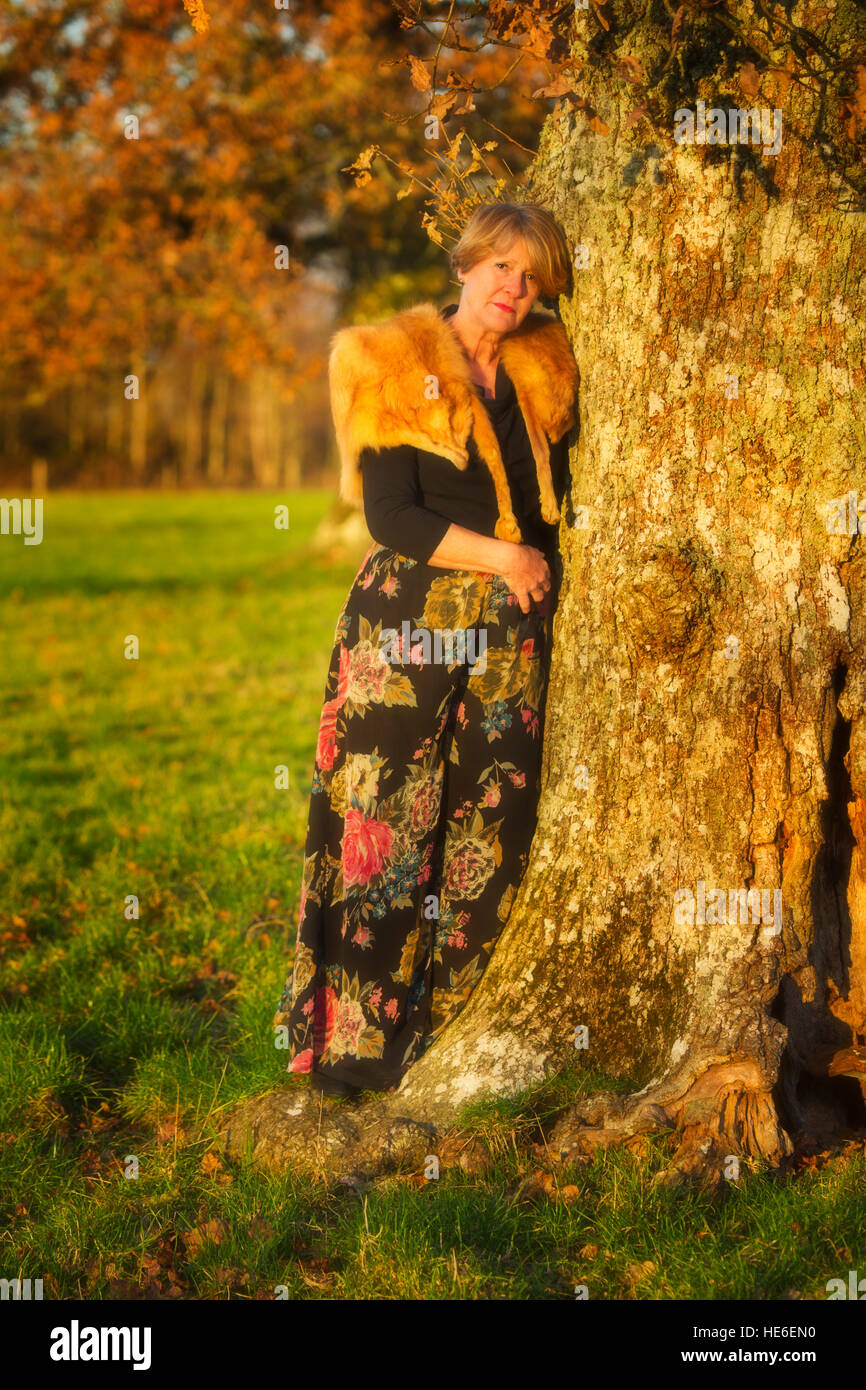 Middle age lady waring vintage fox fur Stock Photo