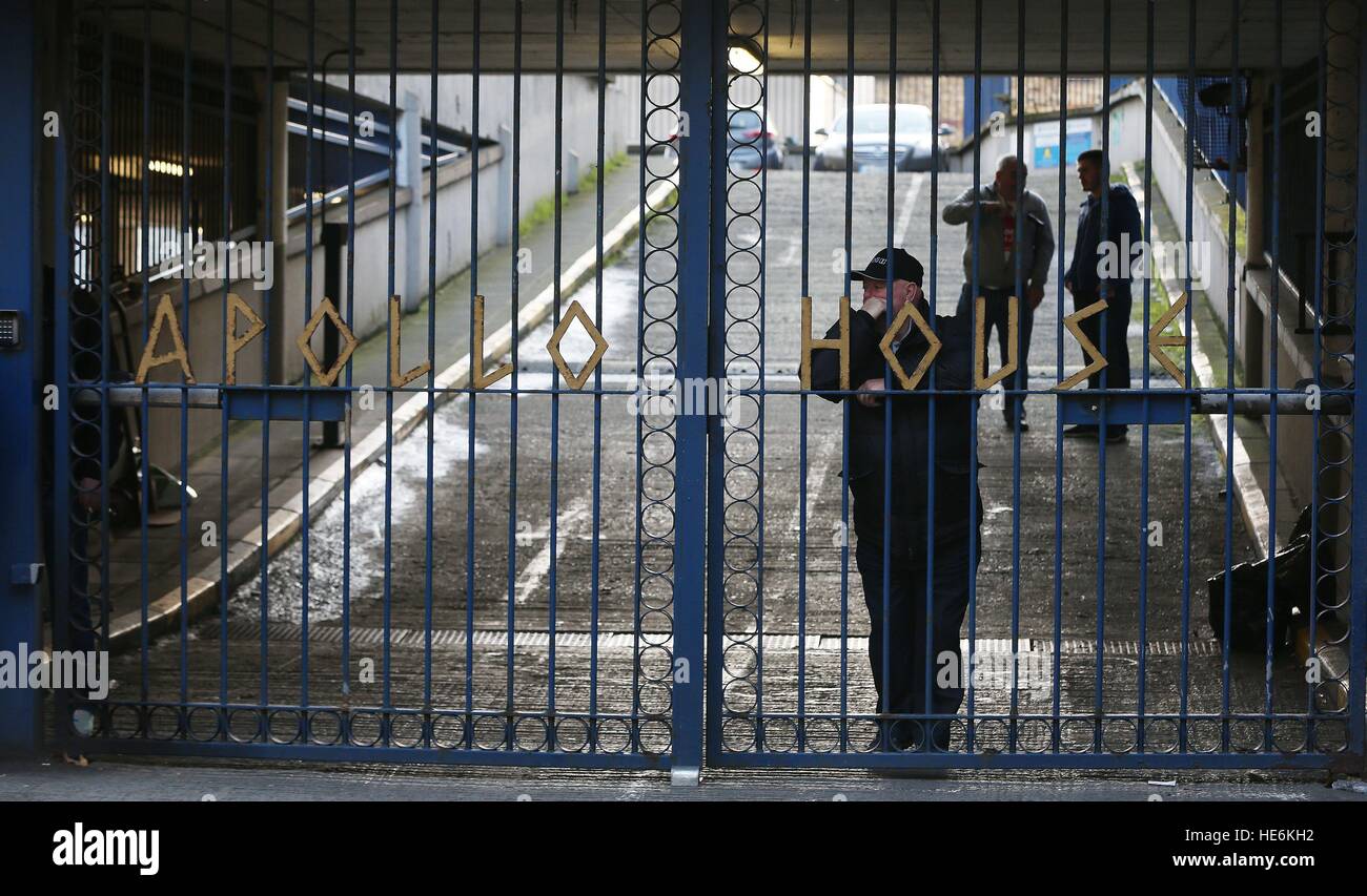 People stand behind the gates of Apollo House, a vacant office block in Dublin city centre which has been occupied by the Homeless activist group 'Home Sweet Home'. Stock Photo