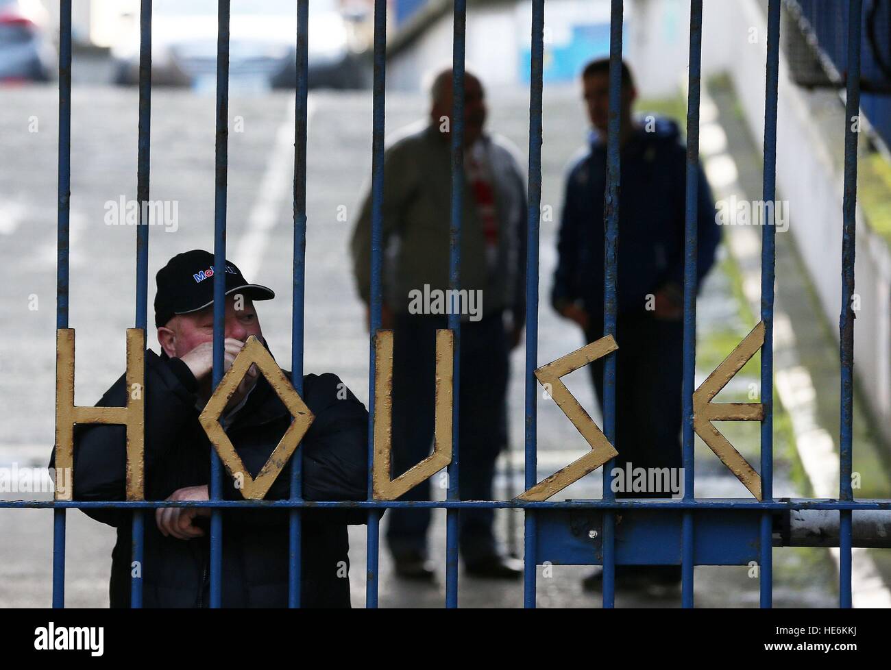 People stand behind the gates of Apollo House, a vacant office block in Dublin city centre which has been occupied by the Homeless activist group 'Home Sweet Home'. Stock Photo