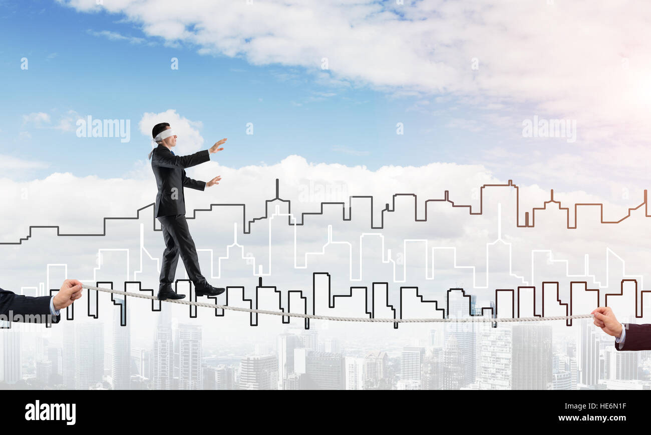 Business concept of risk support and assistance with man balancing on ...
