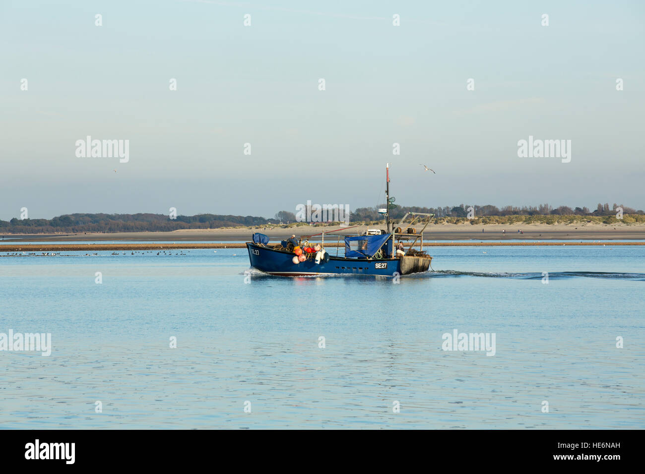 Small Wooden Fishing Boat With Fishing Net In Calm Water Stock Photo,  Picture and Royalty Free Image. Image 92232323.