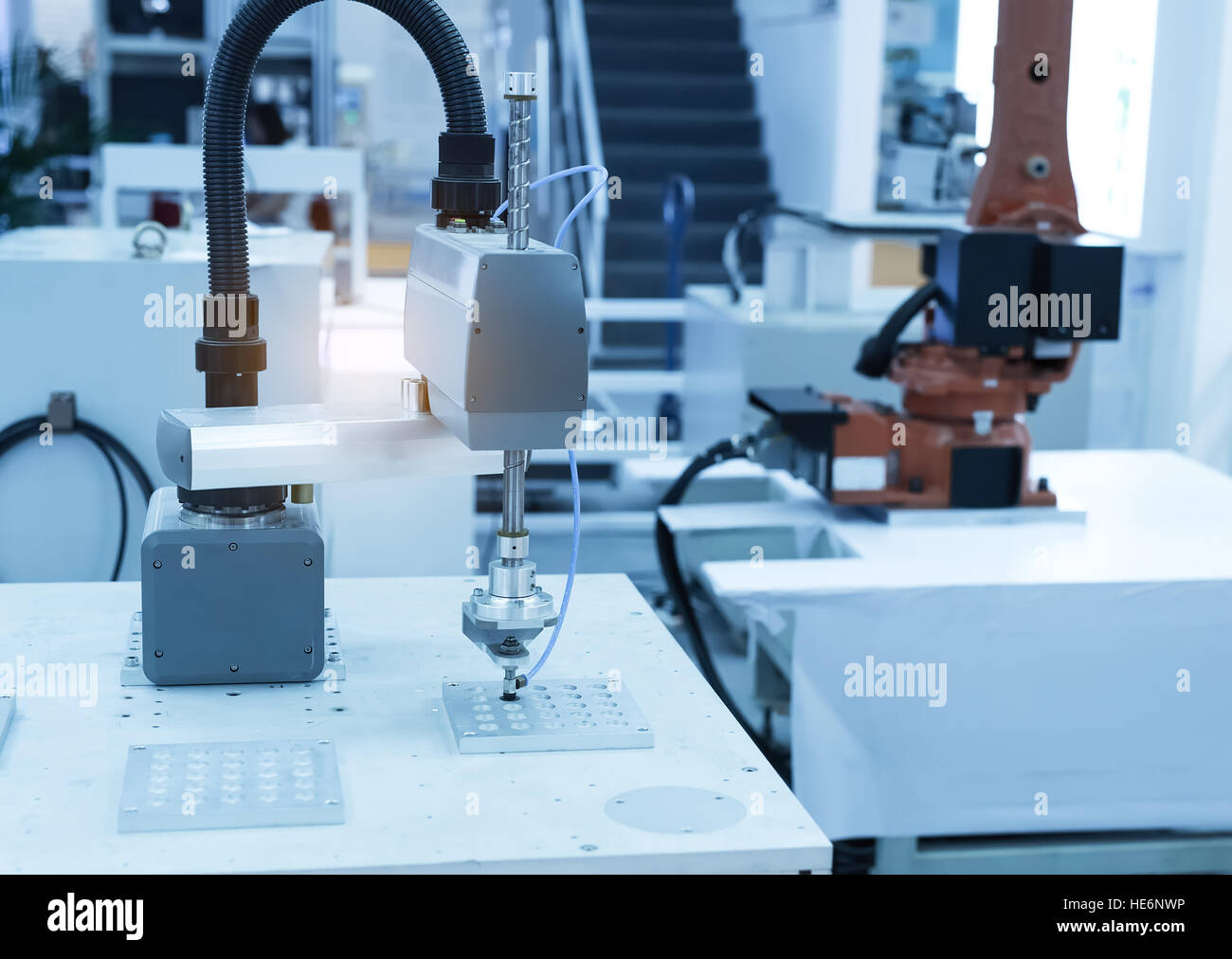 Robotic arm at production line in factory Stock Photo - Alamy