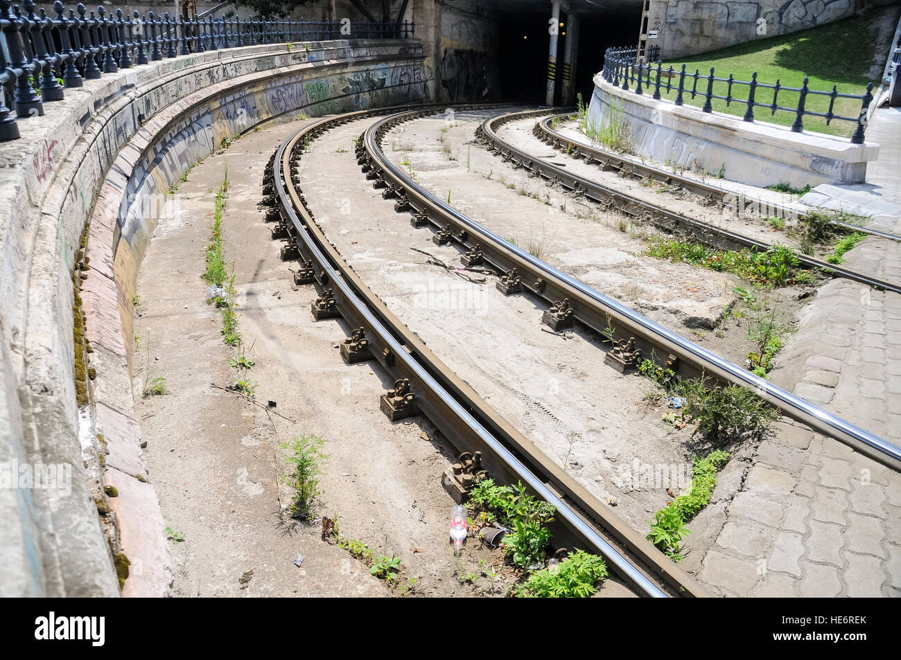 Tram tracks in Budapest disappear into a tunnel under Castle Hill. Stock Photo