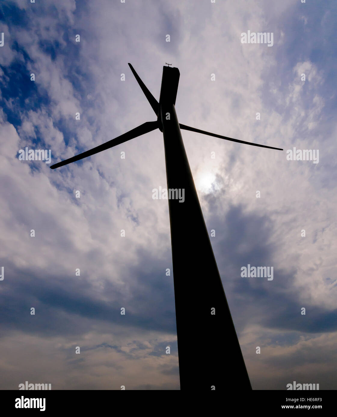 Silhouetted wind turbine at a rural windfarm. Stock Photo