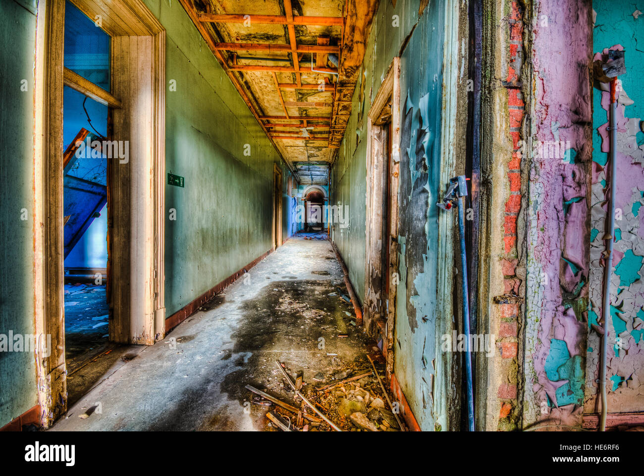 Peeling paint on the walls of a corridor in an old abandoned building