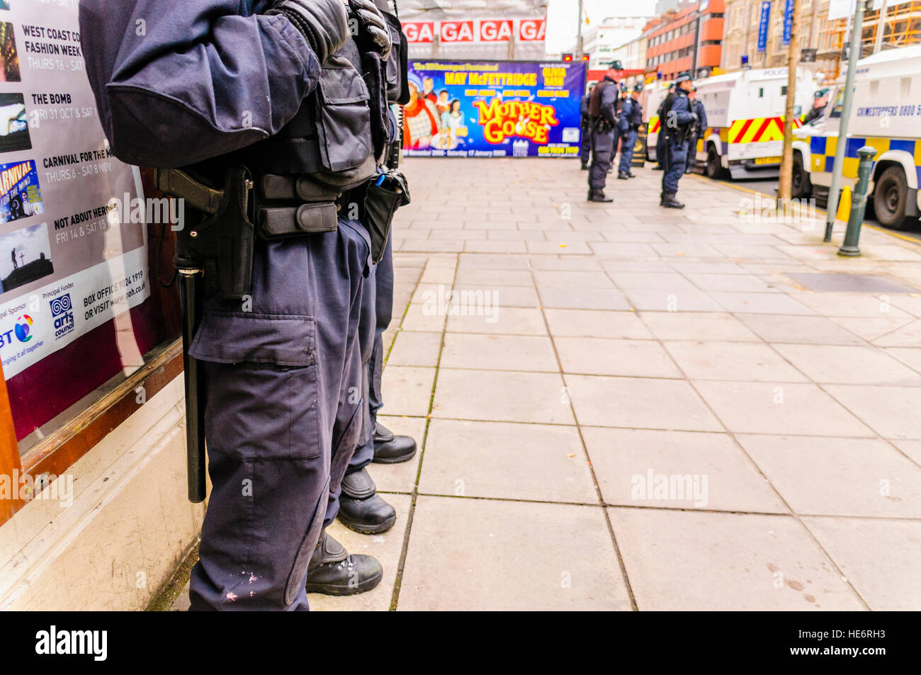 Two armed police officers from the PSNI stand guard during an event where civil unrest is possible. Stock Photo