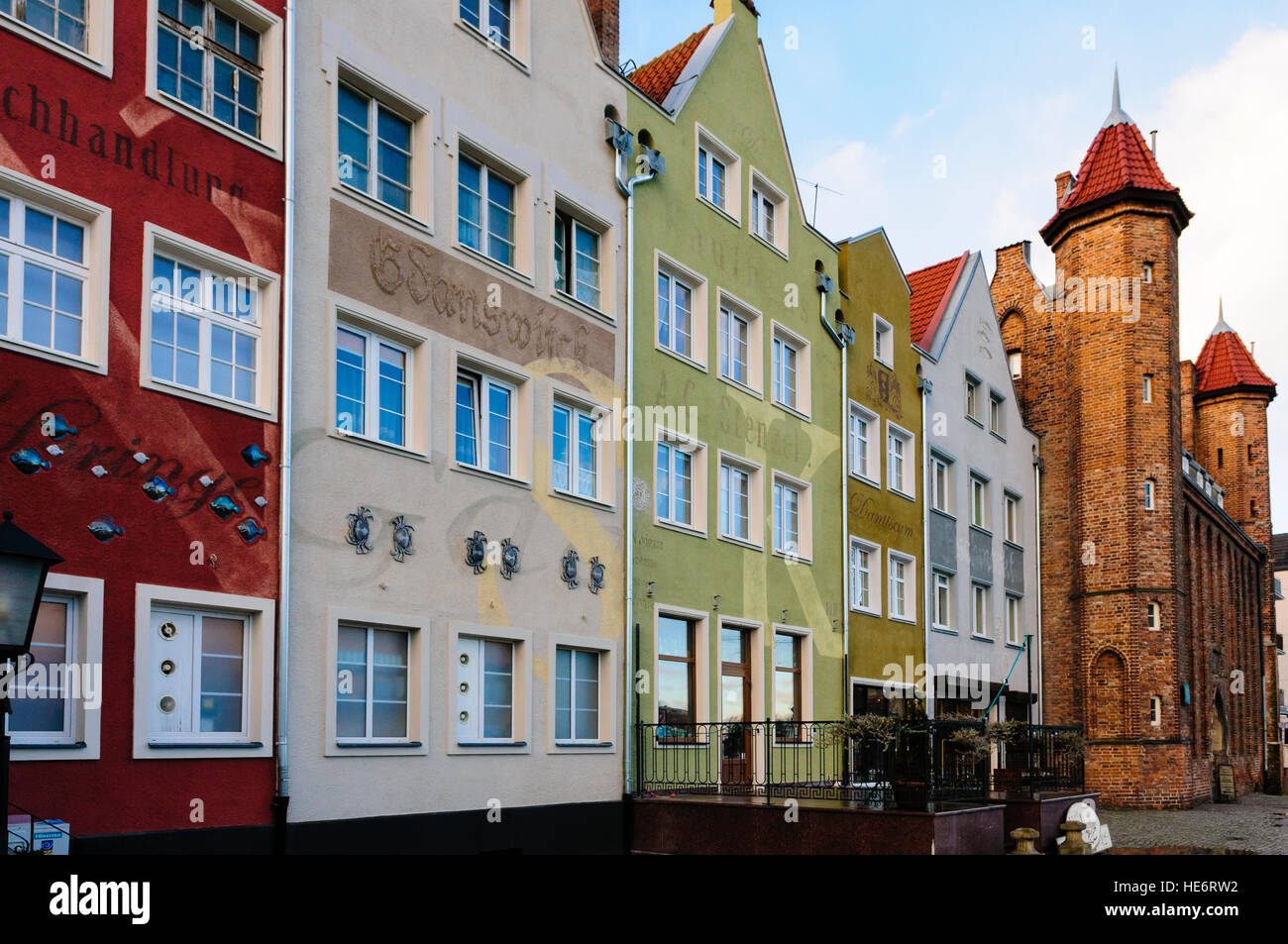 Multicoloured buildings along the riverbank, Gdansk Stock Photo